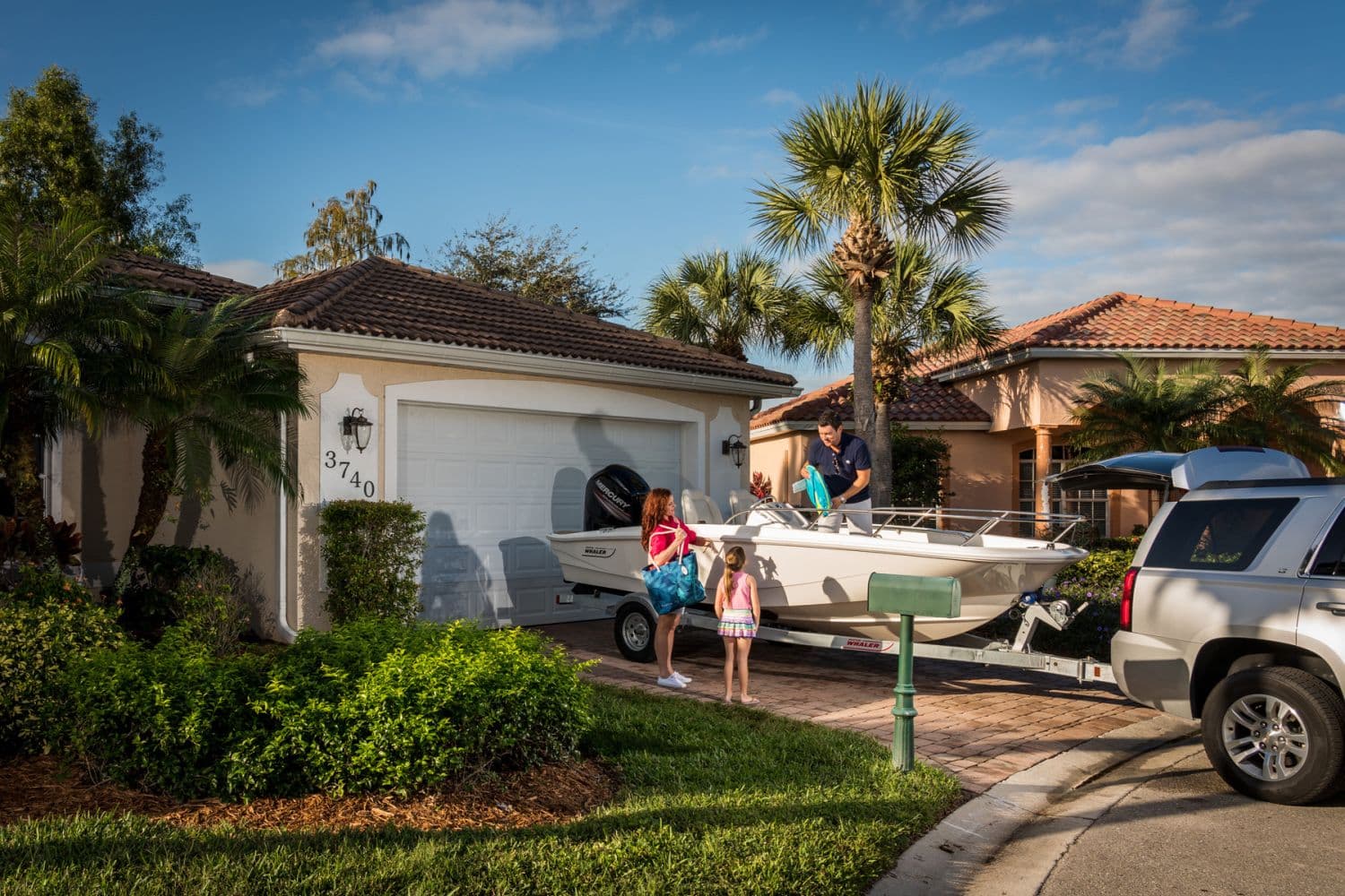 Family loading Boston Whaler 160 Super Sport 2026 onto trailer.