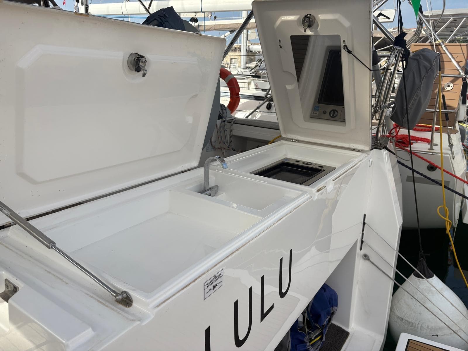 Bavaria C50 yacht deck with open storage compartments, 2022 model.