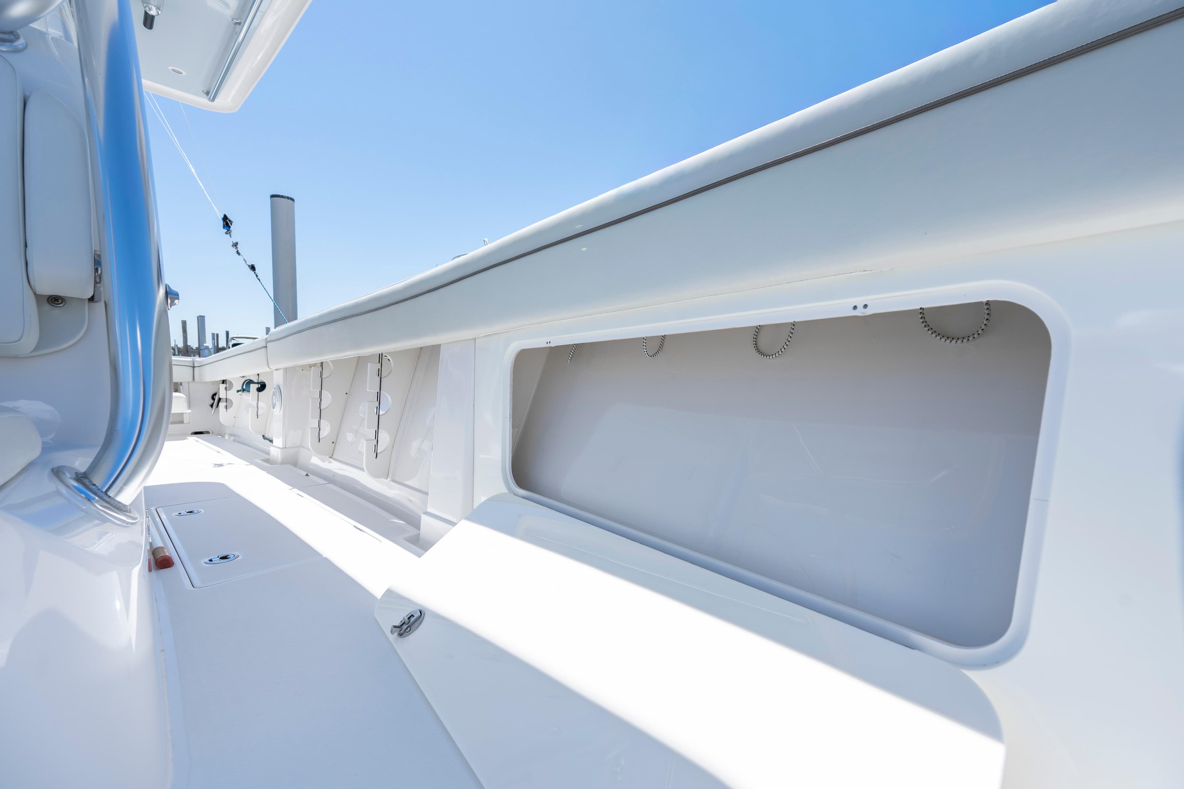 2013 Jupiter 34 FS boat interior with sleek white design and storage compartments.