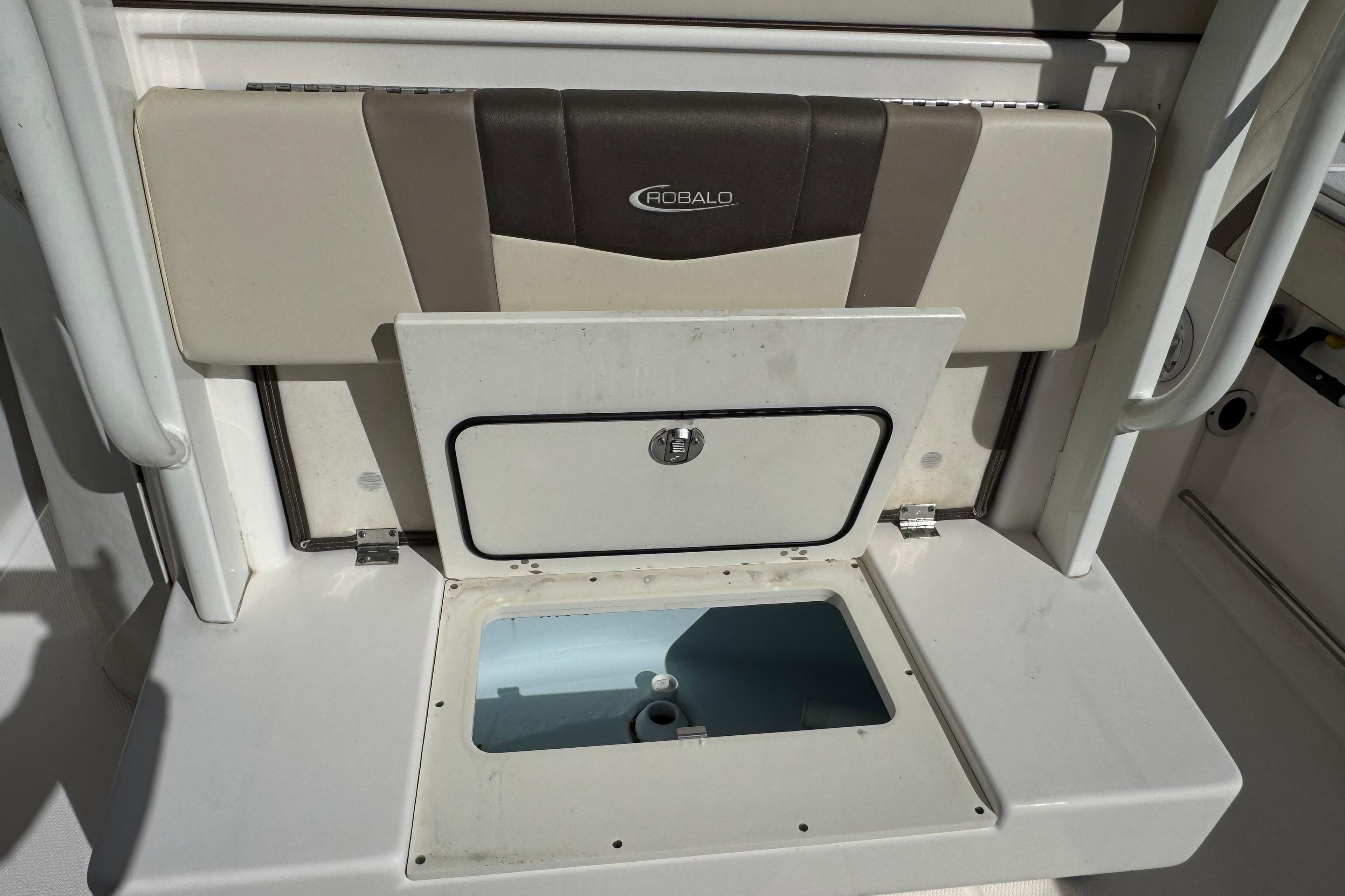 2019 Robalo R272 Center Console boat storage compartment with open hatch.
