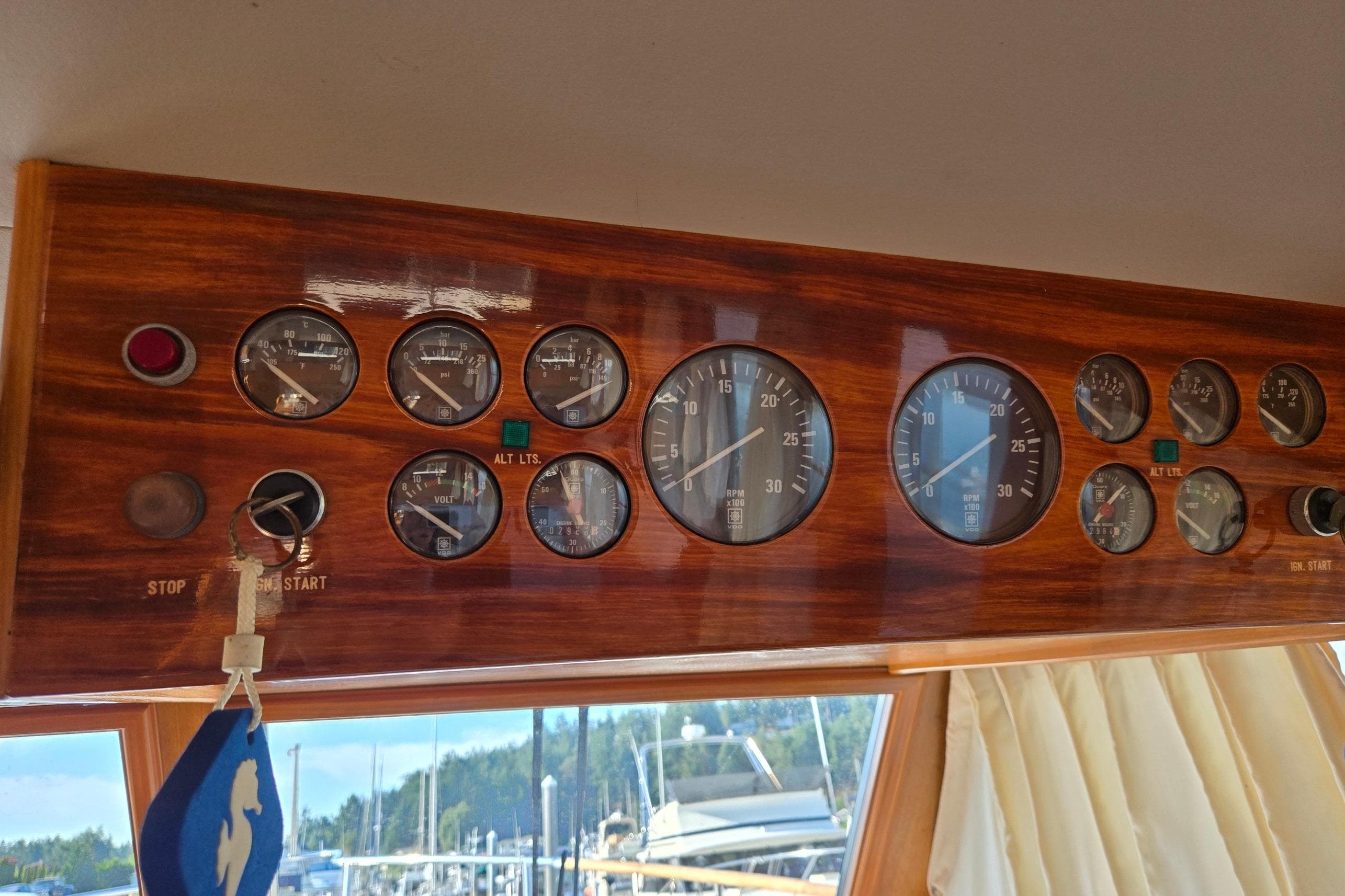 1993 Ocean Alexander 423 Classicco dashboard with gauges and controls in wooden panel.