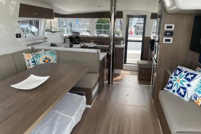 Interior of 2023 Bali 4.2 yacht with modern furnishings and decorative pillows.