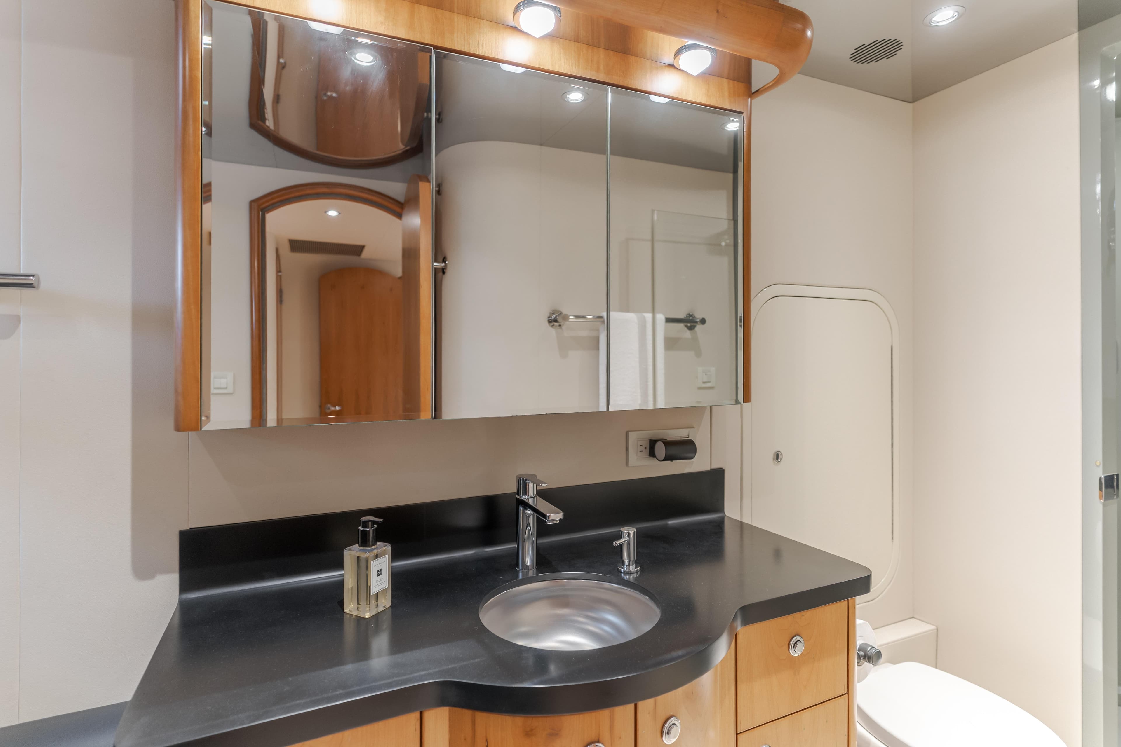 Luxurious bathroom in 2006 Cheoy Lee 72' Raised Pilot House yacht, featuring sleek design and modern fixtures.