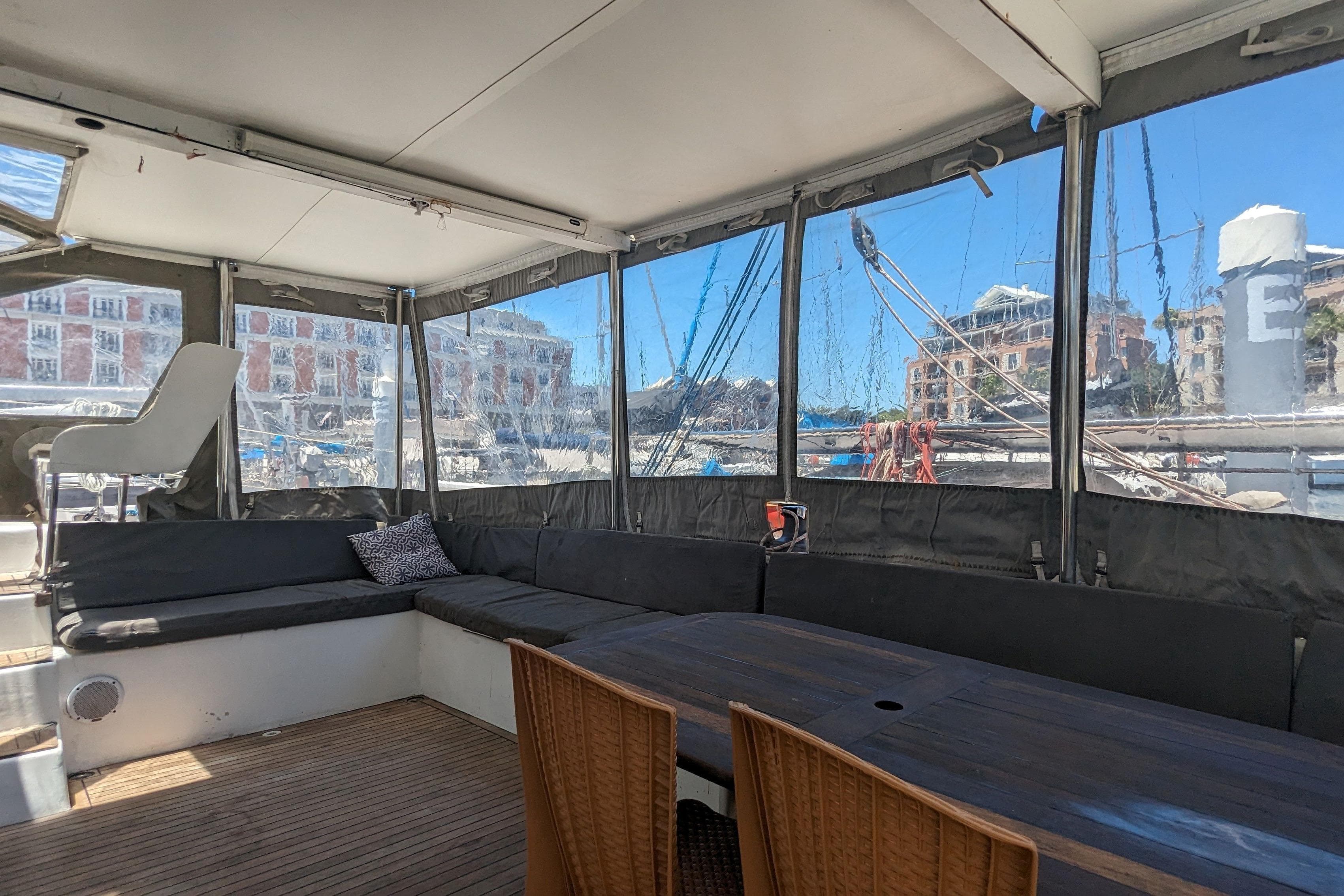 Spacious interior of 2015 Flash Cat 52S yacht with seating and dining area.