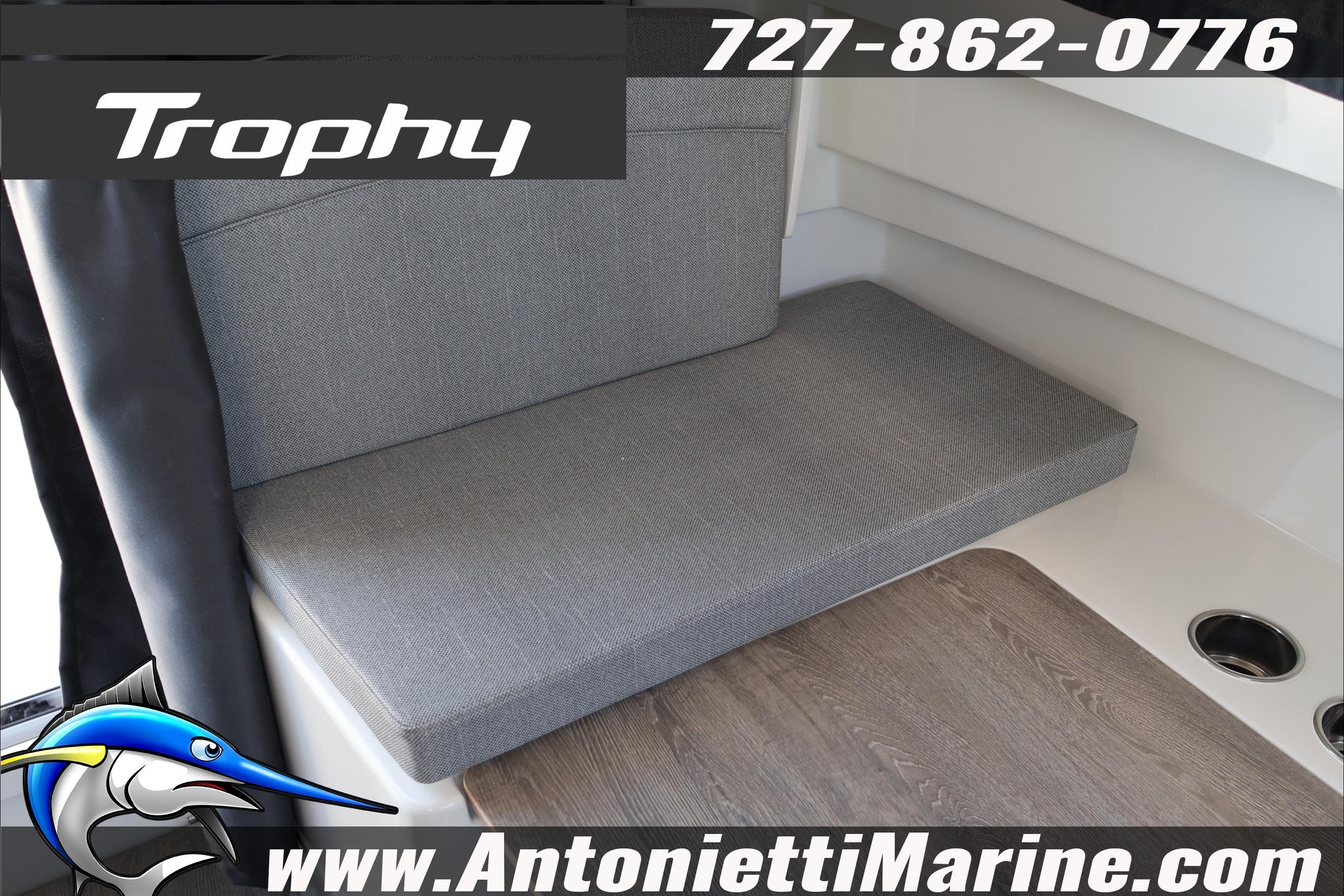 2026 Bayliner Trophy T23 Explorer interior seating with gray upholstery and wood flooring.