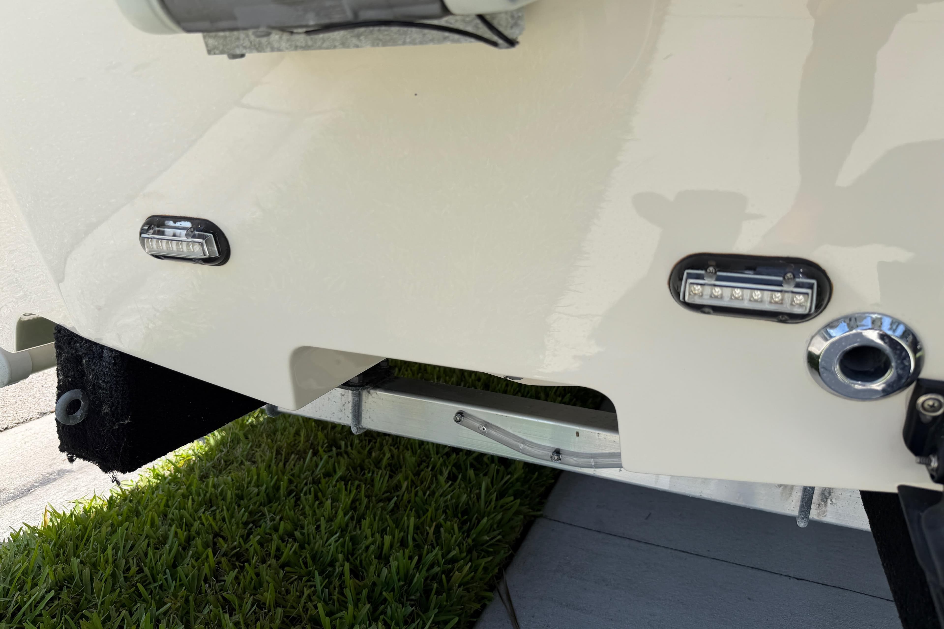 2023 Carolina Skiff 21 LS boat stern with LED lights and trailer detail.