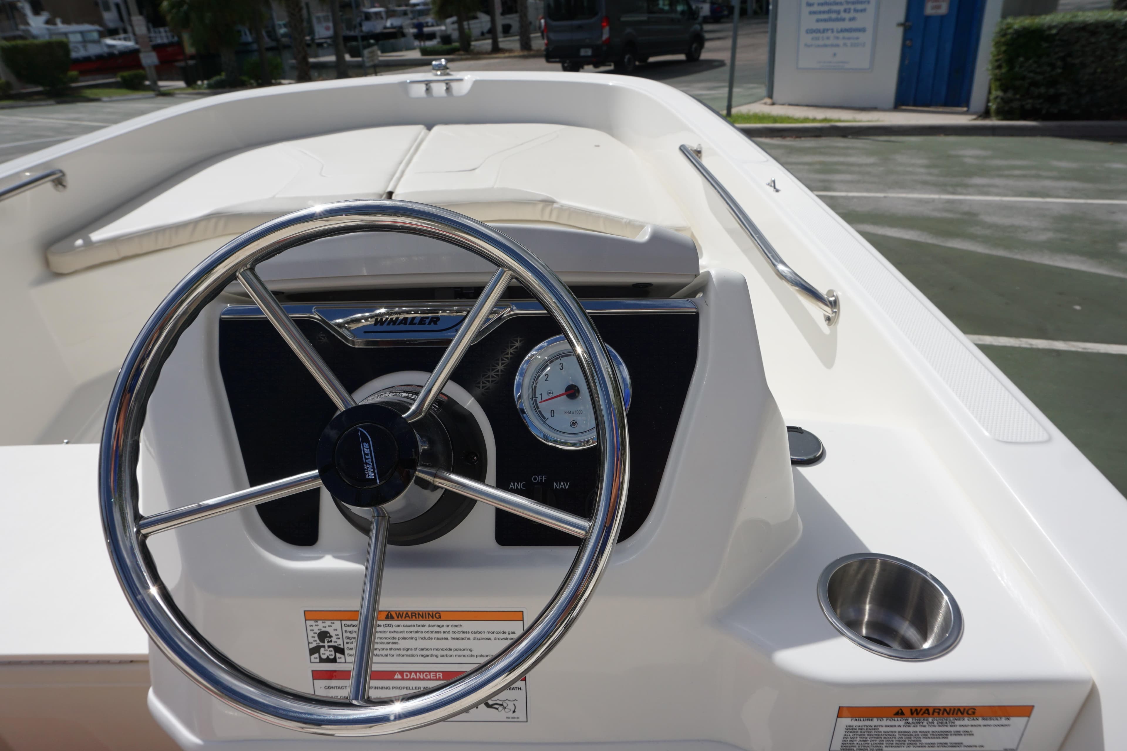 2026 Boston Whaler 160 Super Sport steering wheel and dashboard, featuring a sleek design.