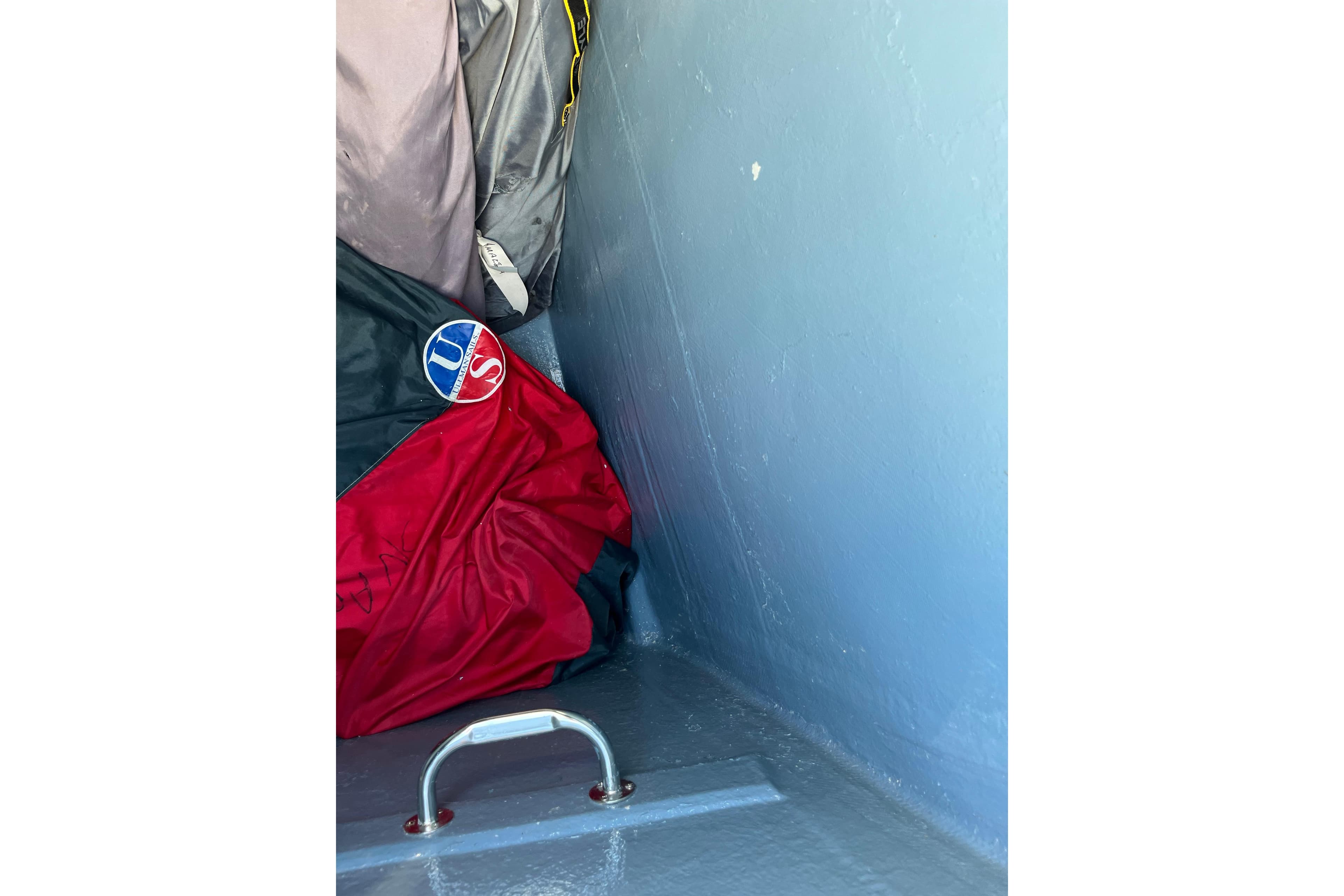 Storage compartment of 2004 Catana 471 Ocean Class Owner's Version with colorful gear.