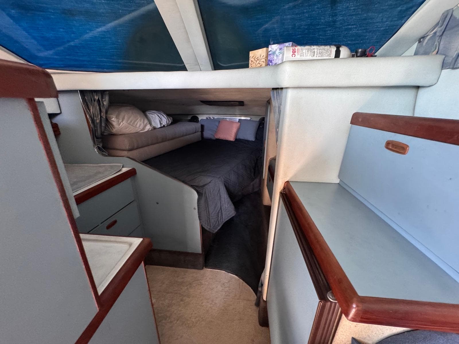 Interior cabin of 1988 Sea Ray 265 Sedan Bridge with bed and storage.