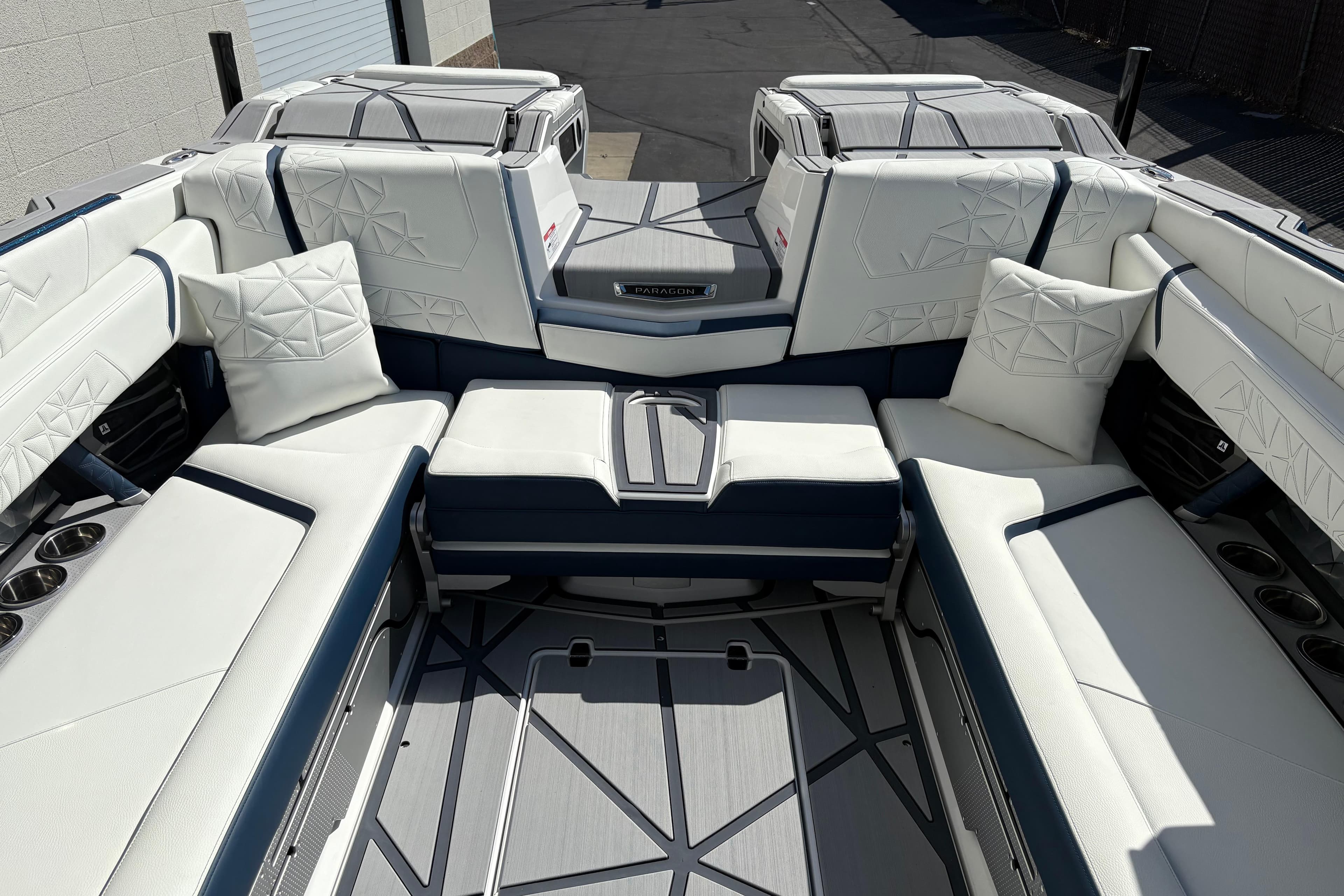 2026 Nautique Super Air Nautique G25 Paragon interior with luxurious white seating and cushions.