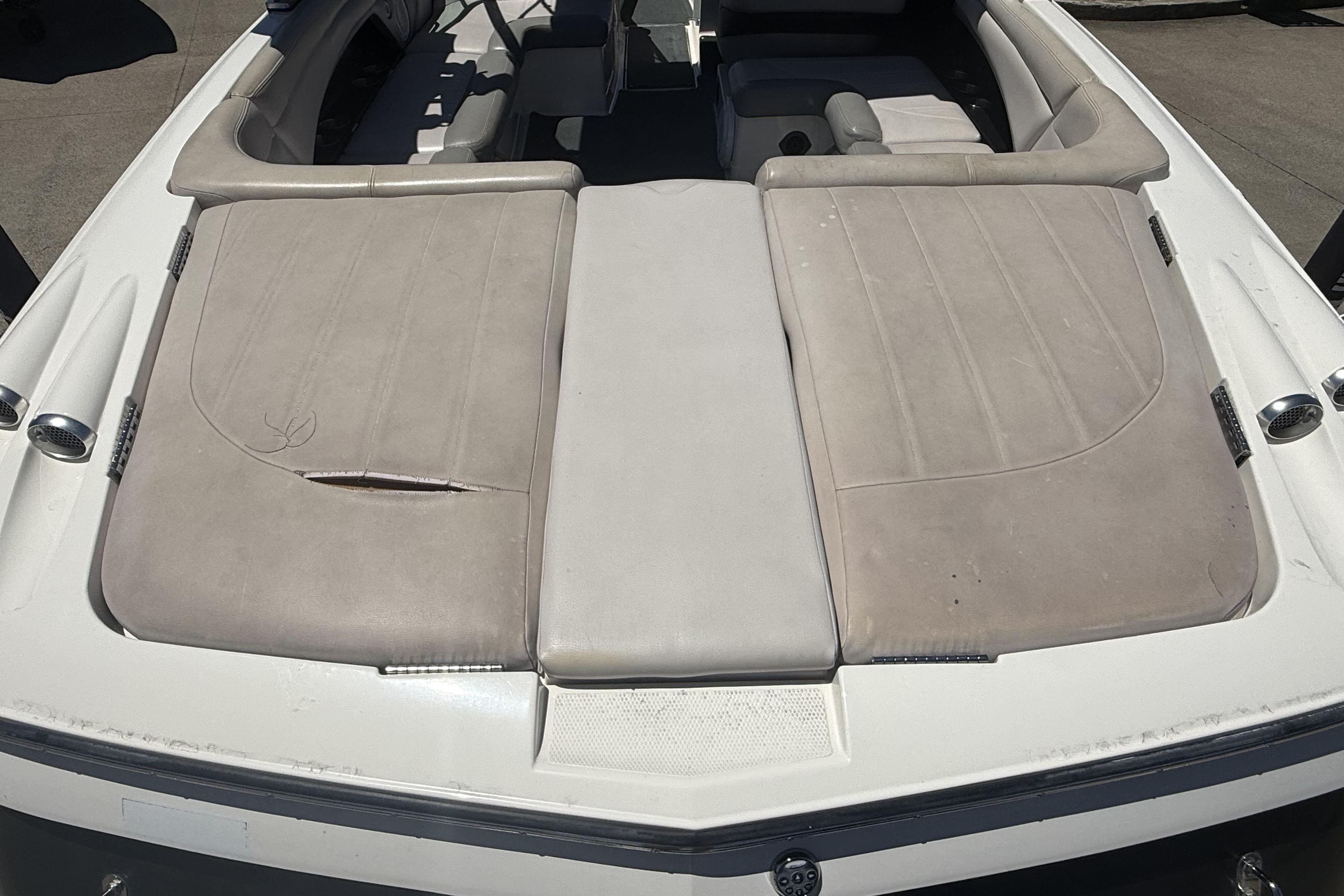 2008 MasterCraft X-45 boat interior with beige upholstery and visible wear.