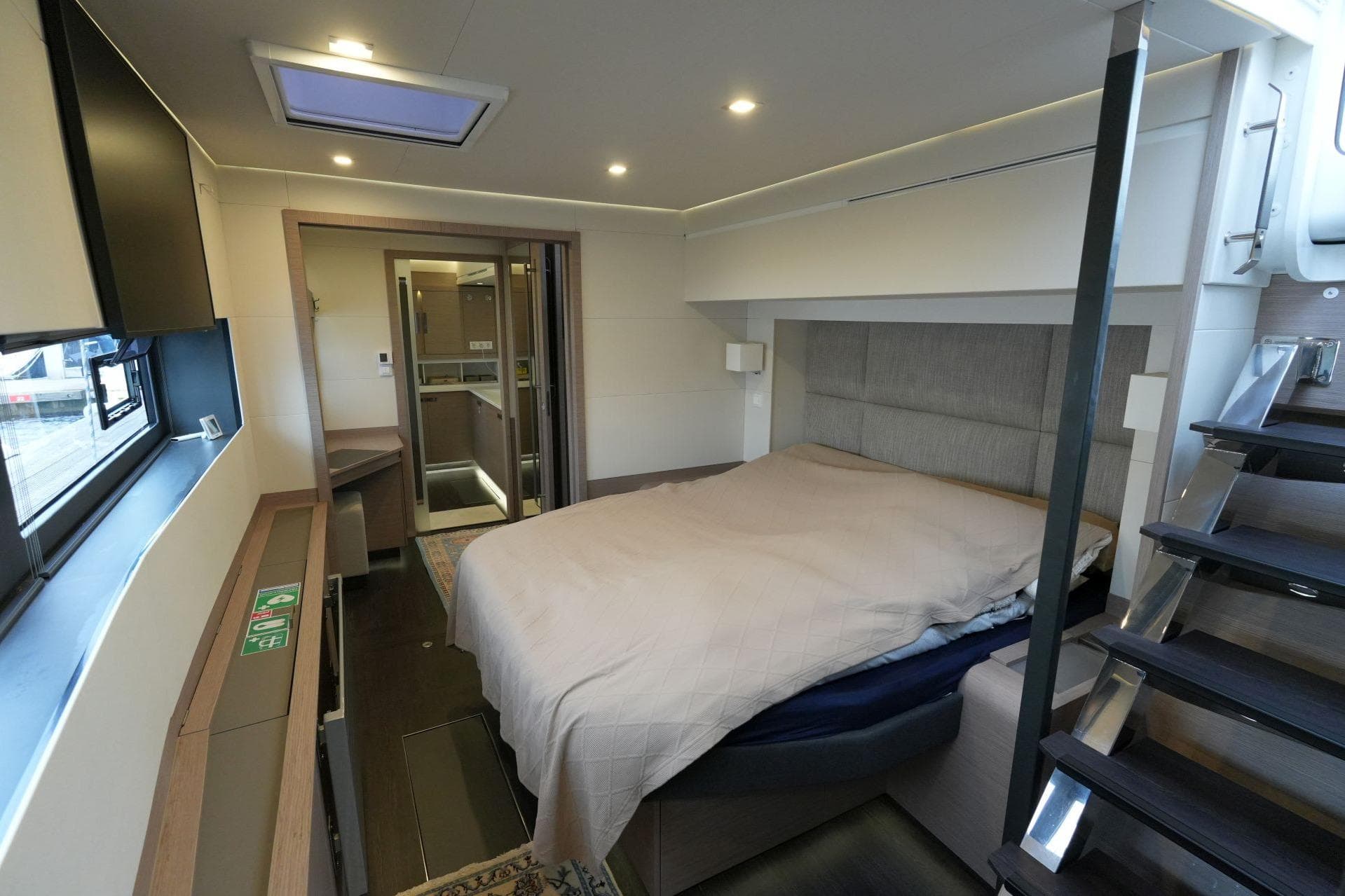Luxurious bedroom interior of 2022 Fountaine Pajot Alegria 67 yacht, featuring modern design.