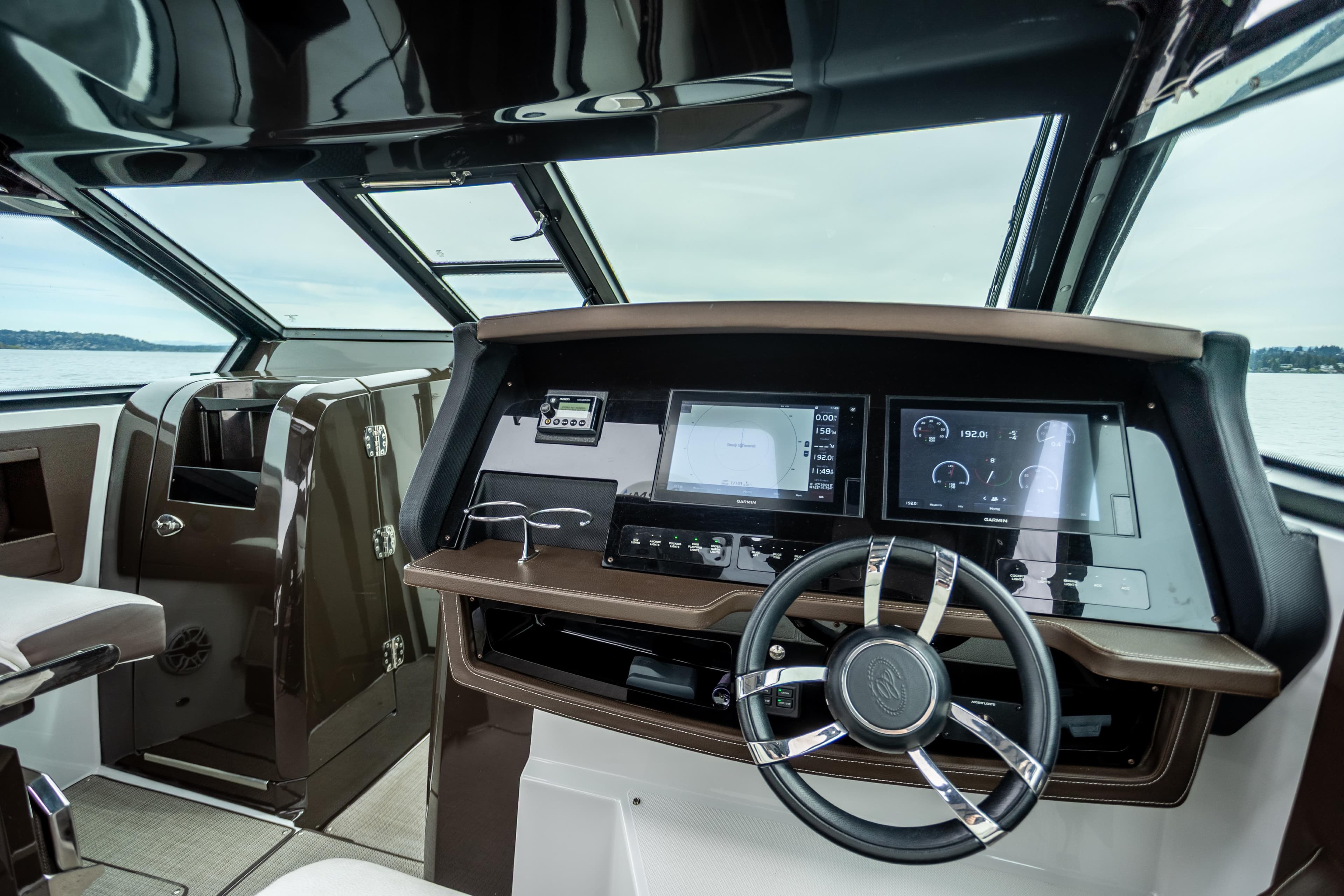Interior cockpit of 2019 Cobalt A36 boat with modern navigation displays.