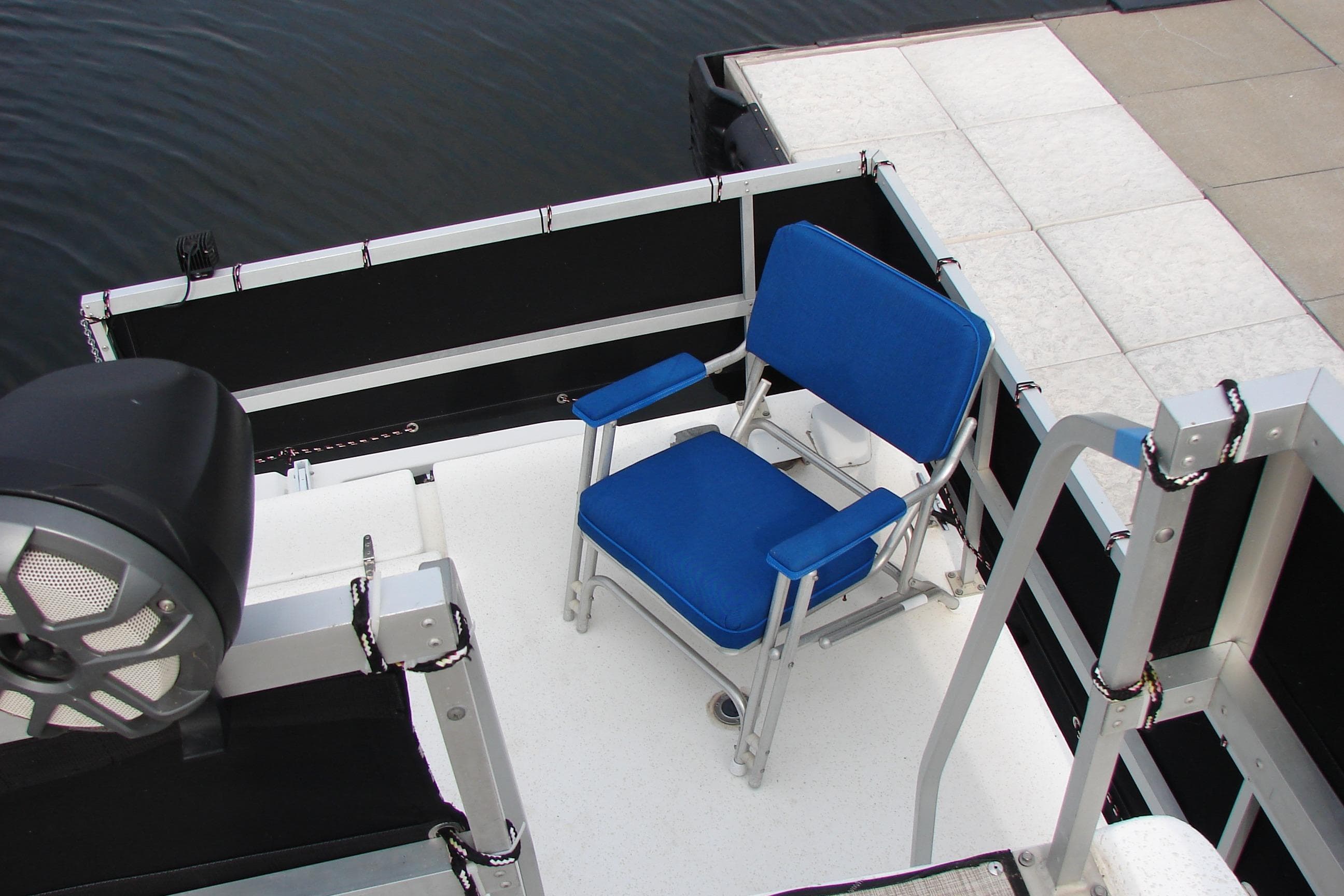 1997 Gibson 47 Sport Houseboat deck with blue chair and speaker.