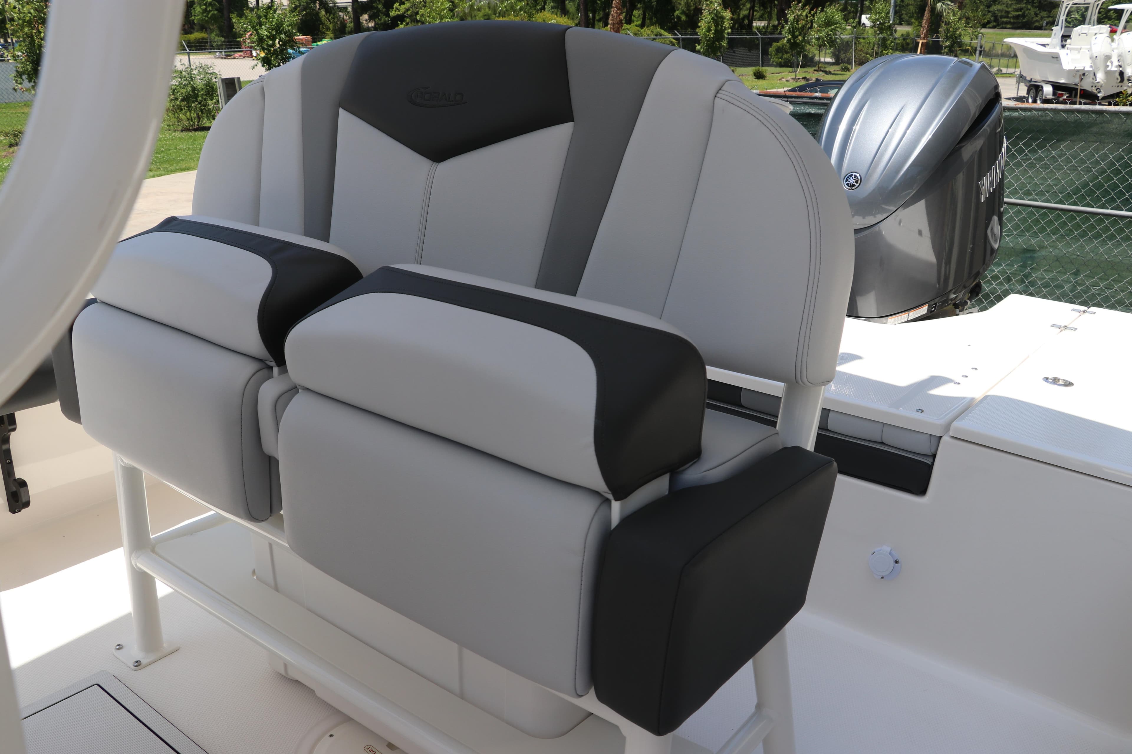2026 Robalo 226 Cayman boat seating with dual-tone upholstery and Yamaha outboard motor.