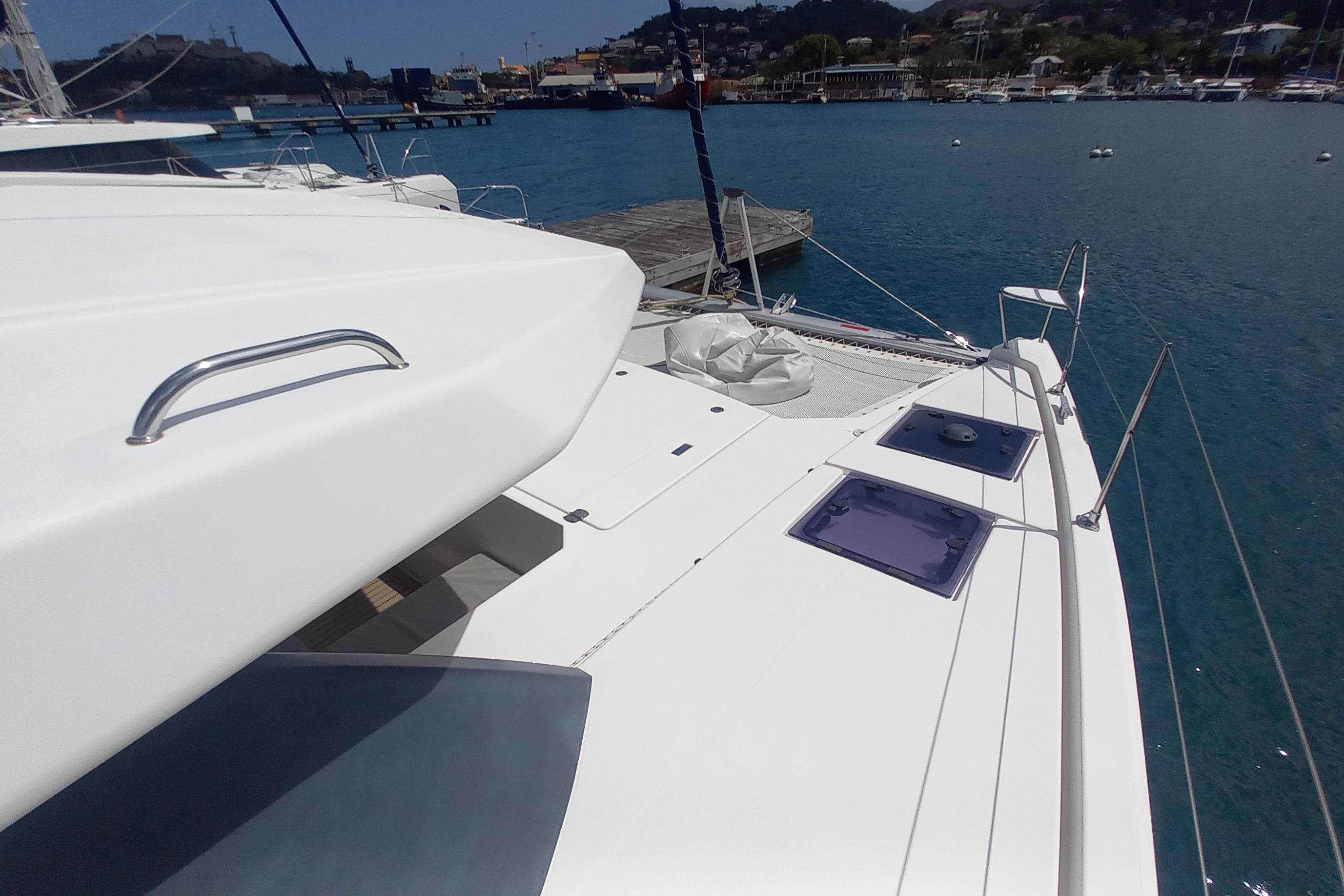Leopard 45 catamaran docked at marina, showcasing sleek deck design, 2019 model.