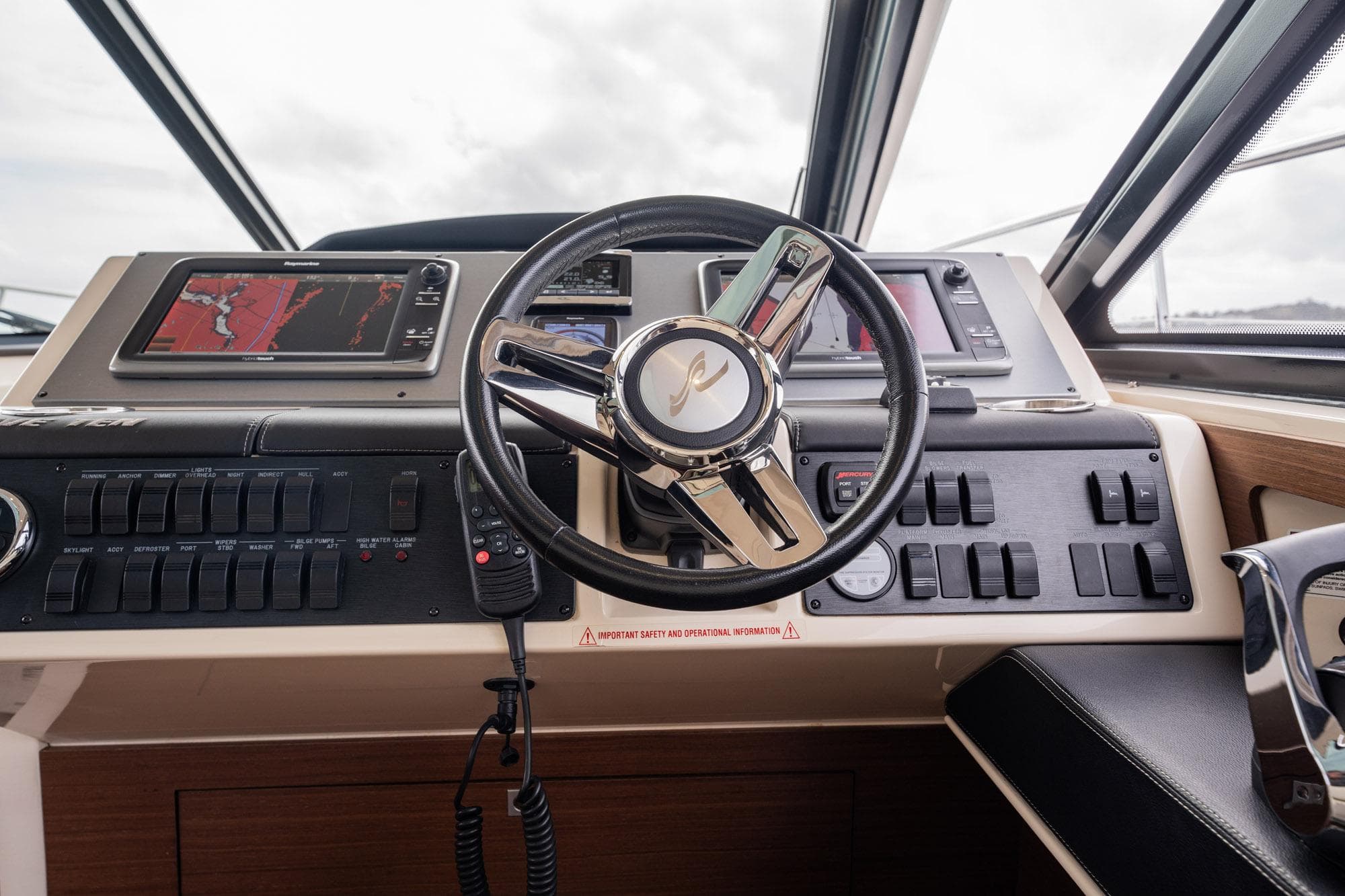 Helm of 2015 Sea Ray 510 Sundancer with navigation controls and steering wheel.
