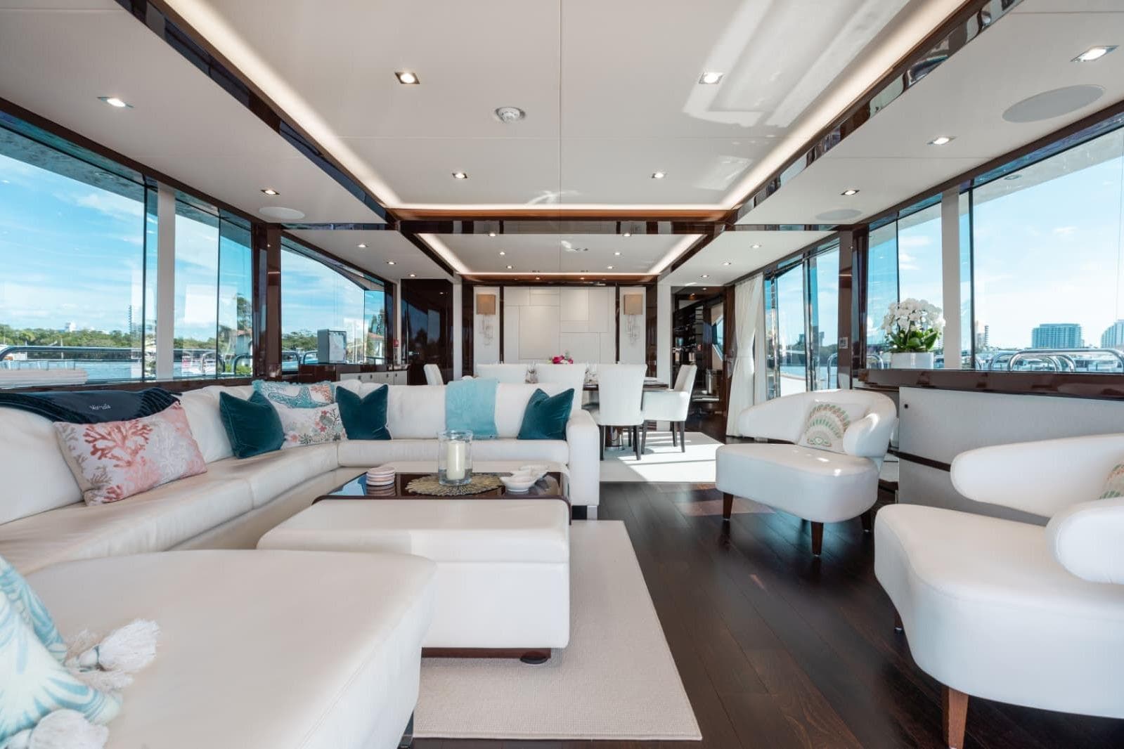 Luxurious interior of 2018 Sunseeker 95 Yacht with elegant seating and panoramic windows.