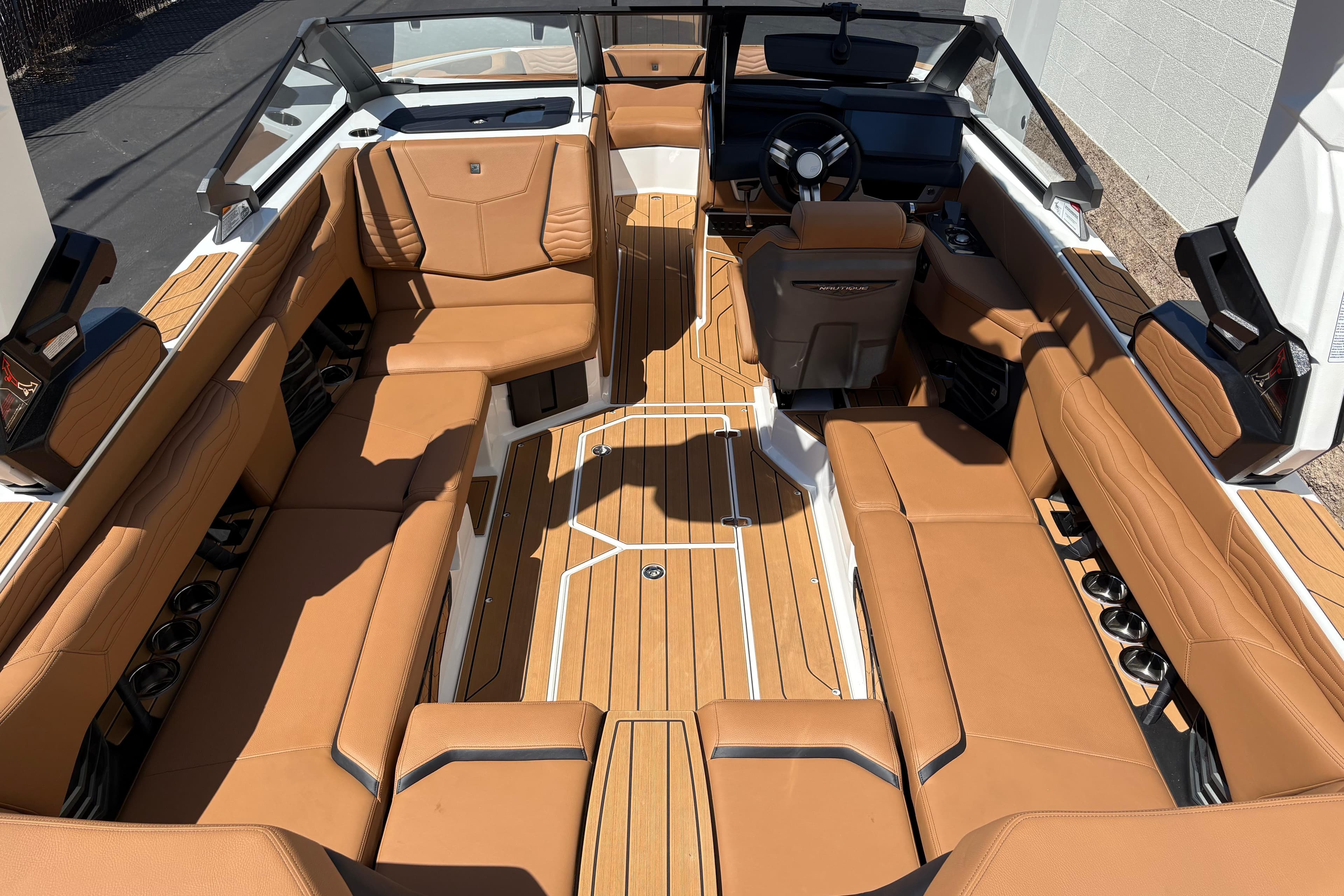2026 Nautique Super Air Nautique G23 interior with tan leather seating and sleek design.