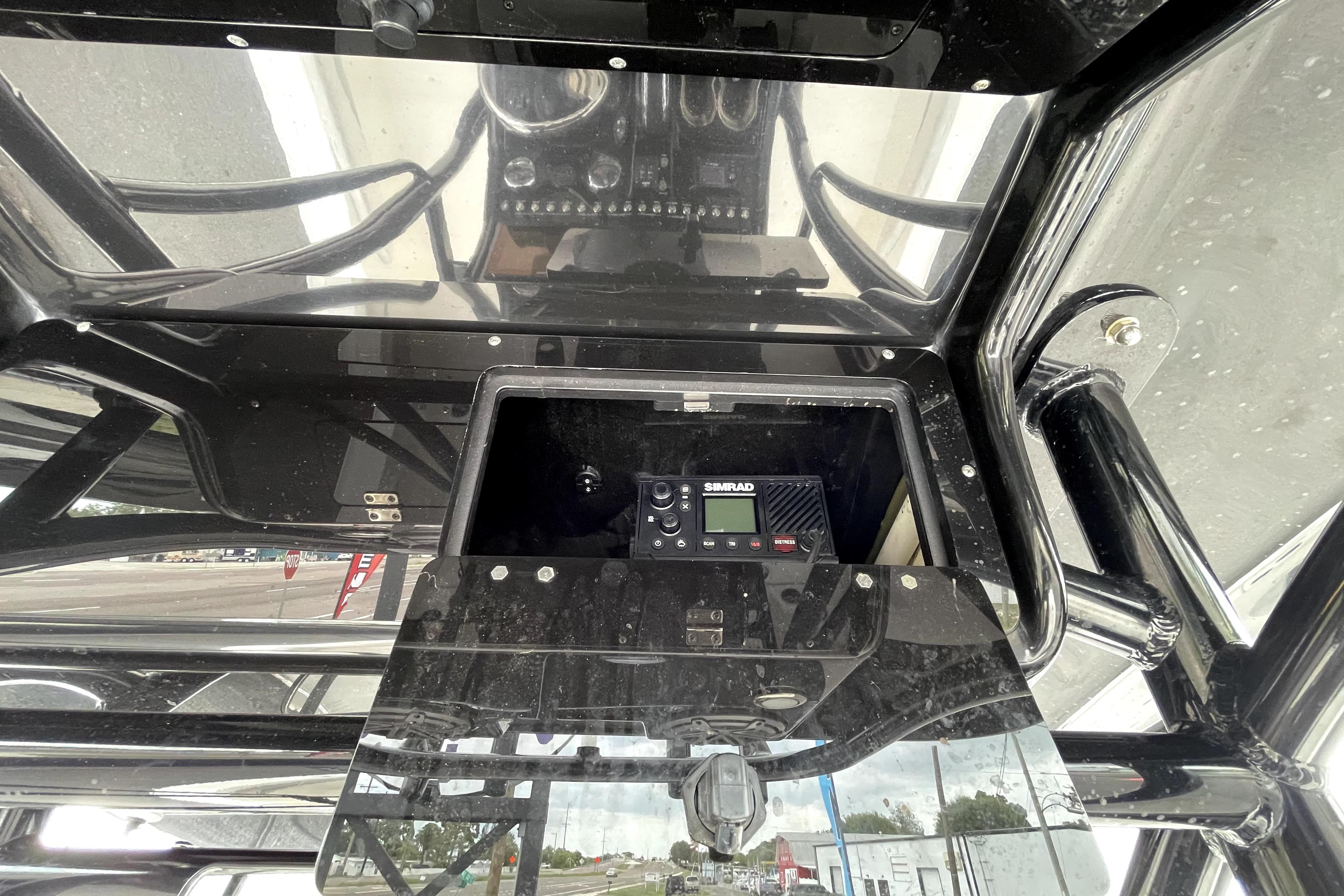 2019 ShearWater 25 LTZ boat dashboard with Simrad electronics and black finish.