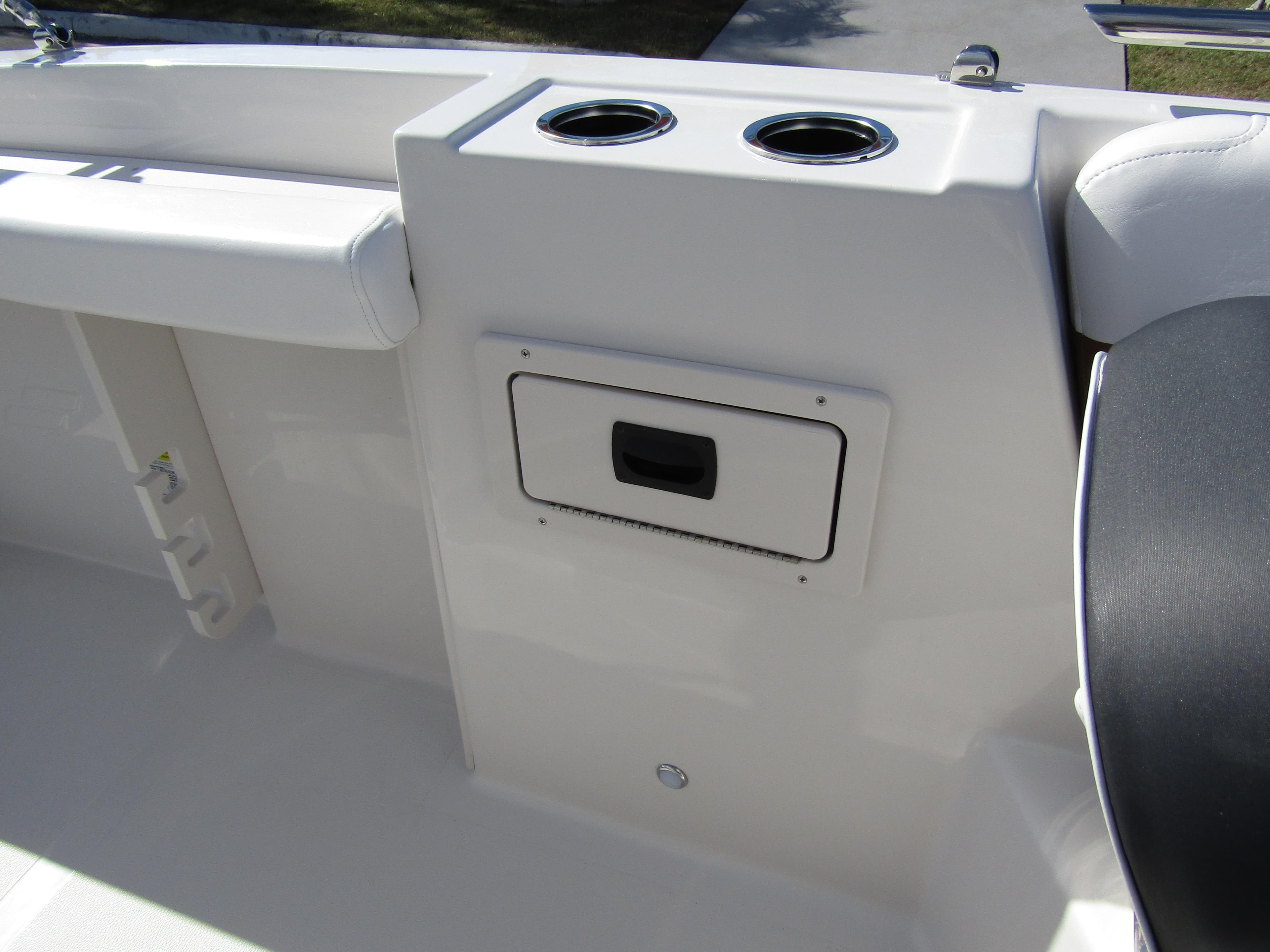 2024 Starcraft SVX 191 OB CC boat interior with cup holders and storage compartment.