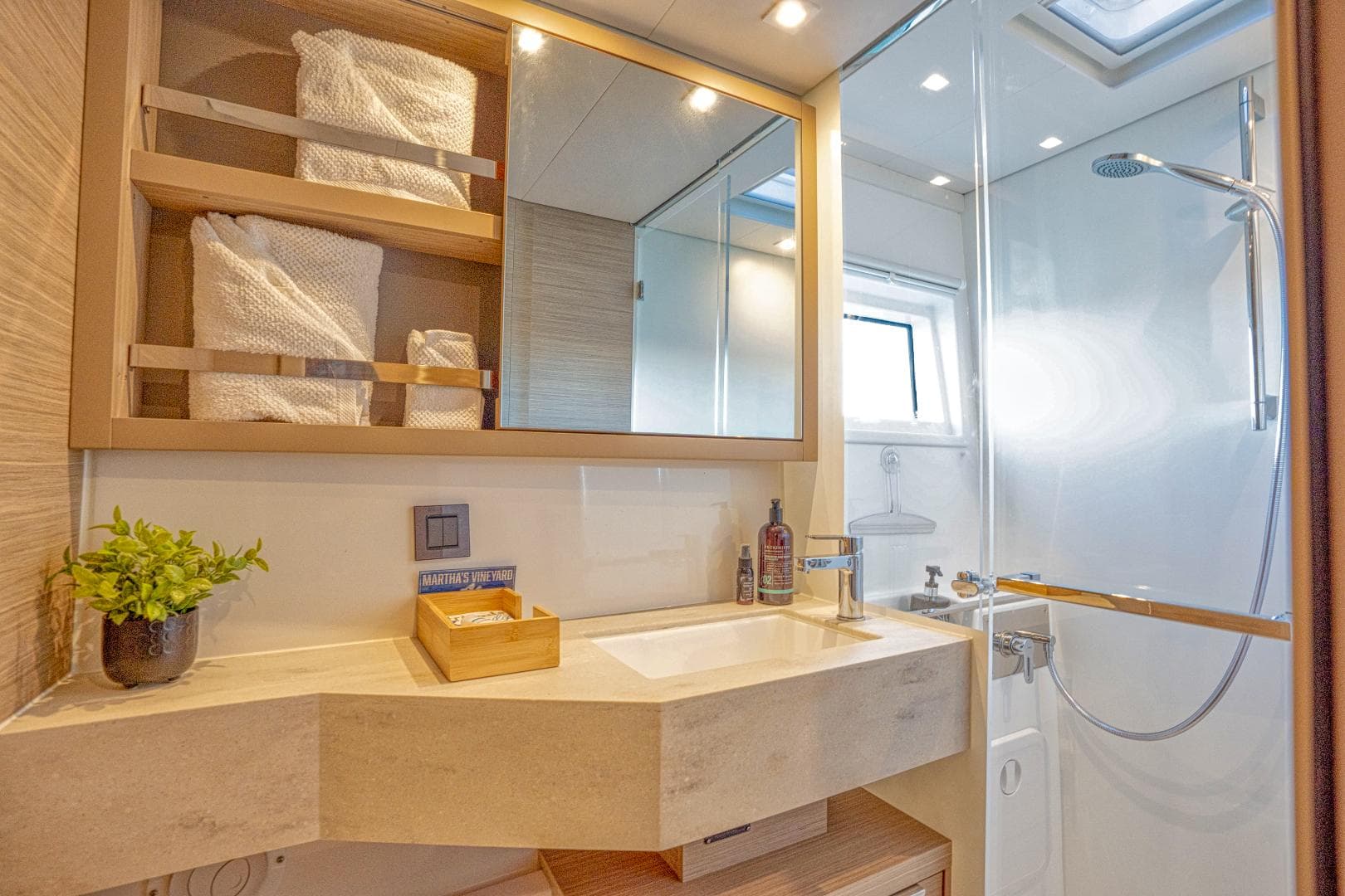 Luxurious bathroom in 2024 Lagoon 46 yacht with modern fixtures and elegant design.