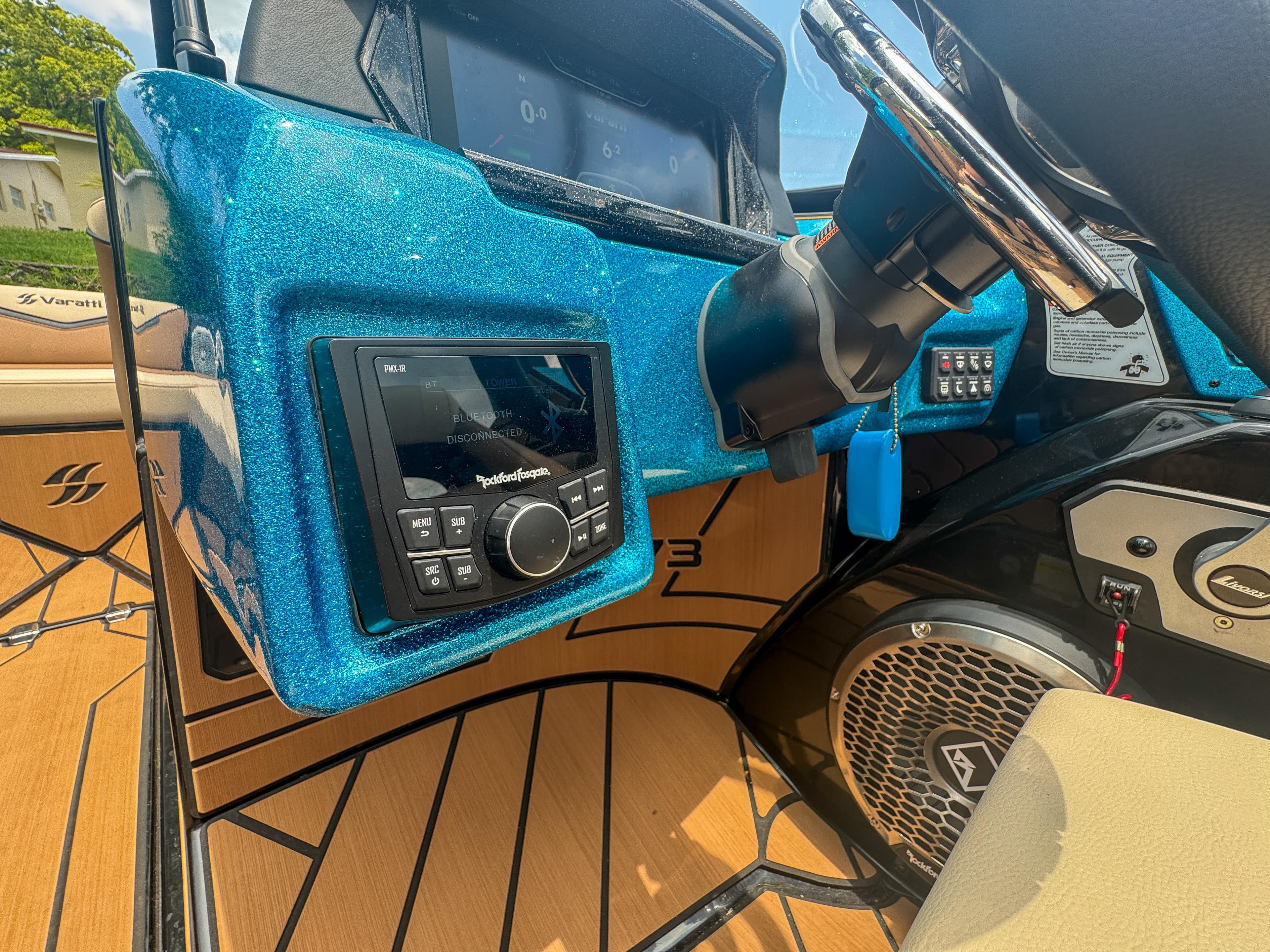 2024 Varatti Z2373 boat dashboard with Rockford Fosgate audio system and steering wheel.