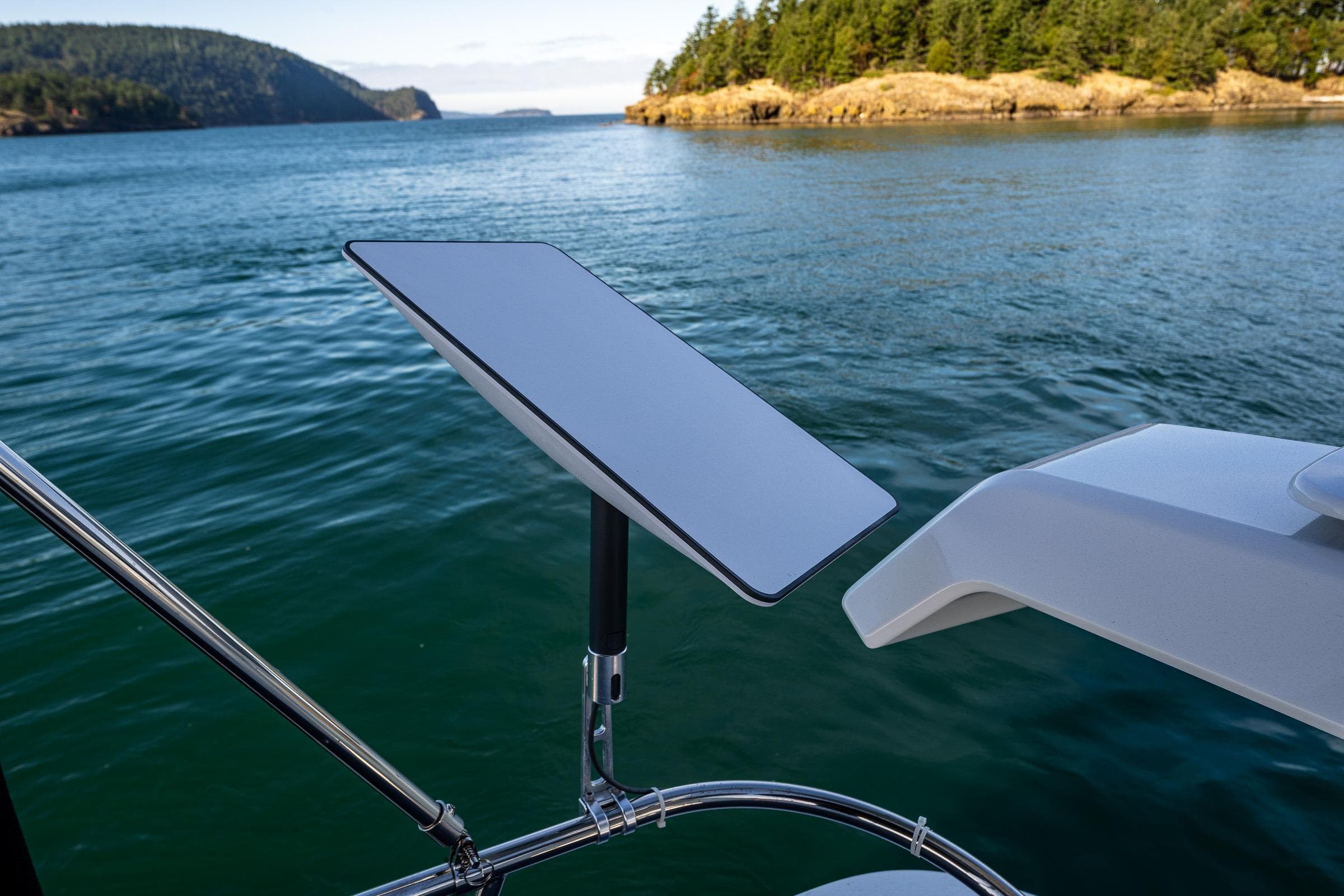 Nimbus 405 Flybridge 2023 with satellite dish on scenic waterway.