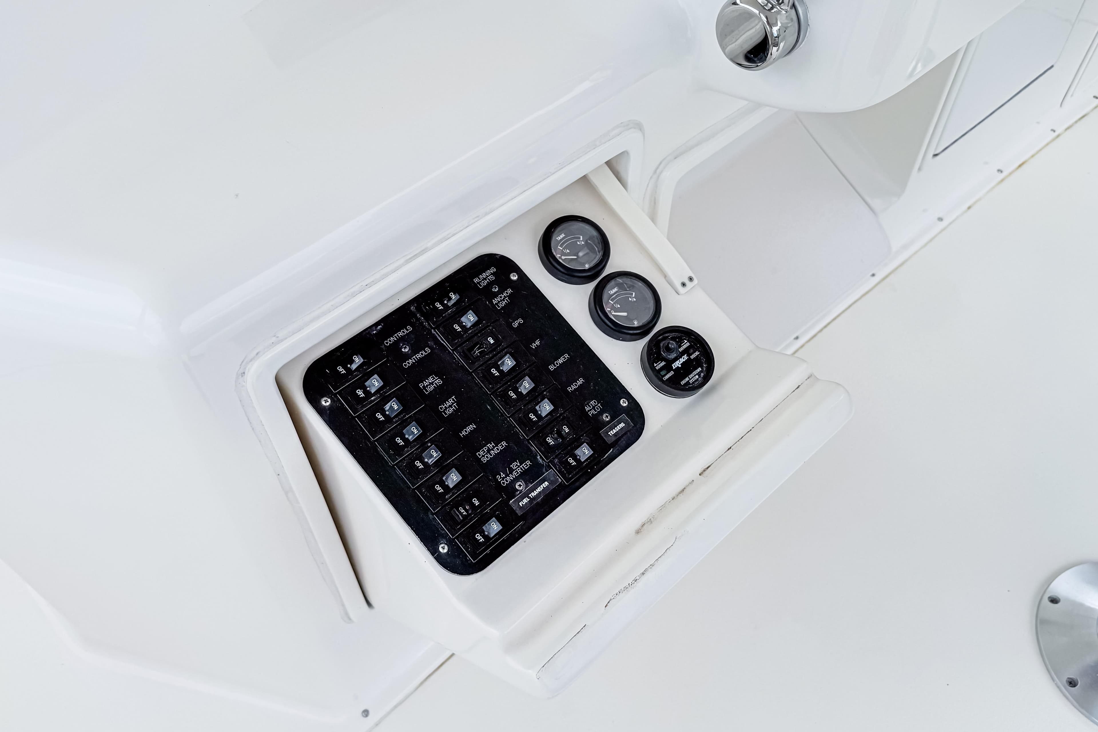 Control panel of a 2004 Ocean Yachts 50 Super Sport, featuring gauges and switches.