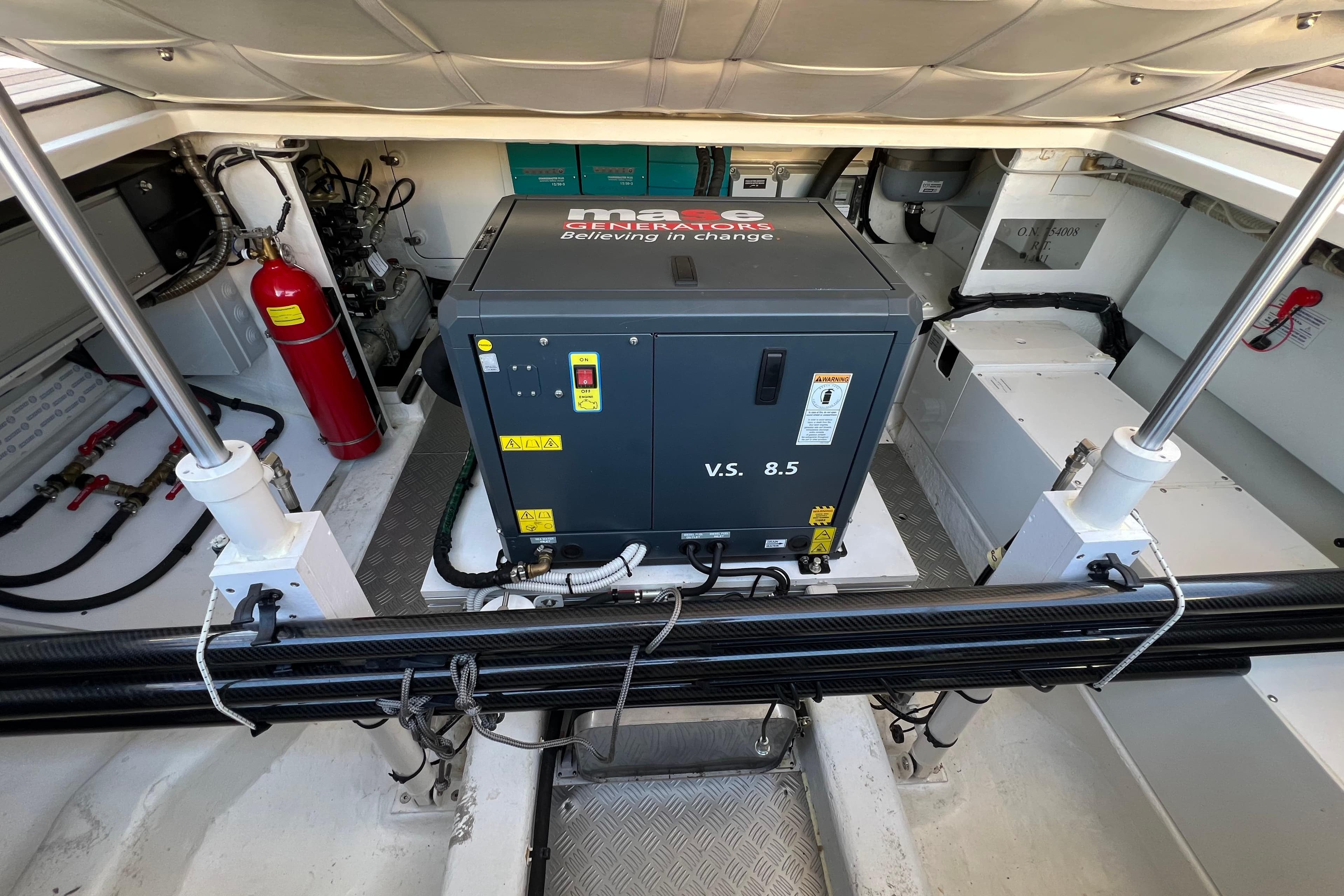 Engine room of 2024 Wally Tender 43 X with generator and fire extinguisher.