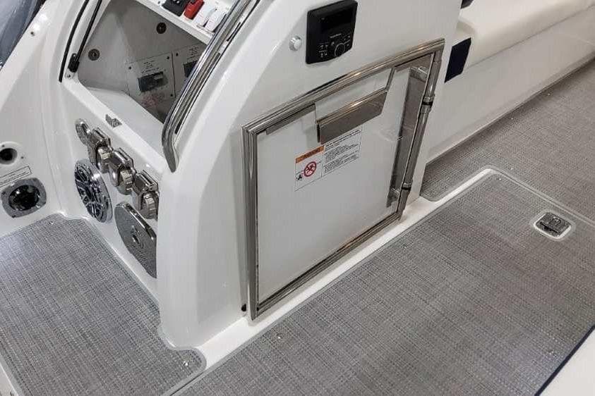 2023 Formula 380 Super Sport Crossover OB interior with control panel and storage compartment.