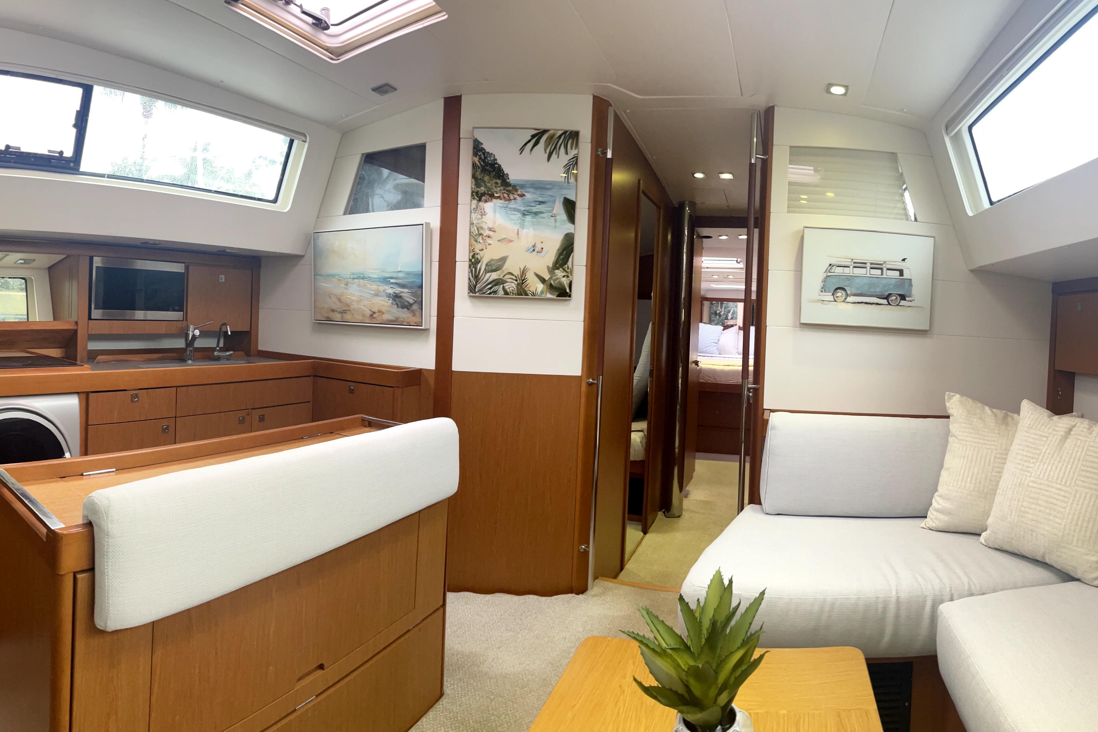 Interior of 2013 Beneteau Sense 46 yacht with modern decor and comfortable seating.