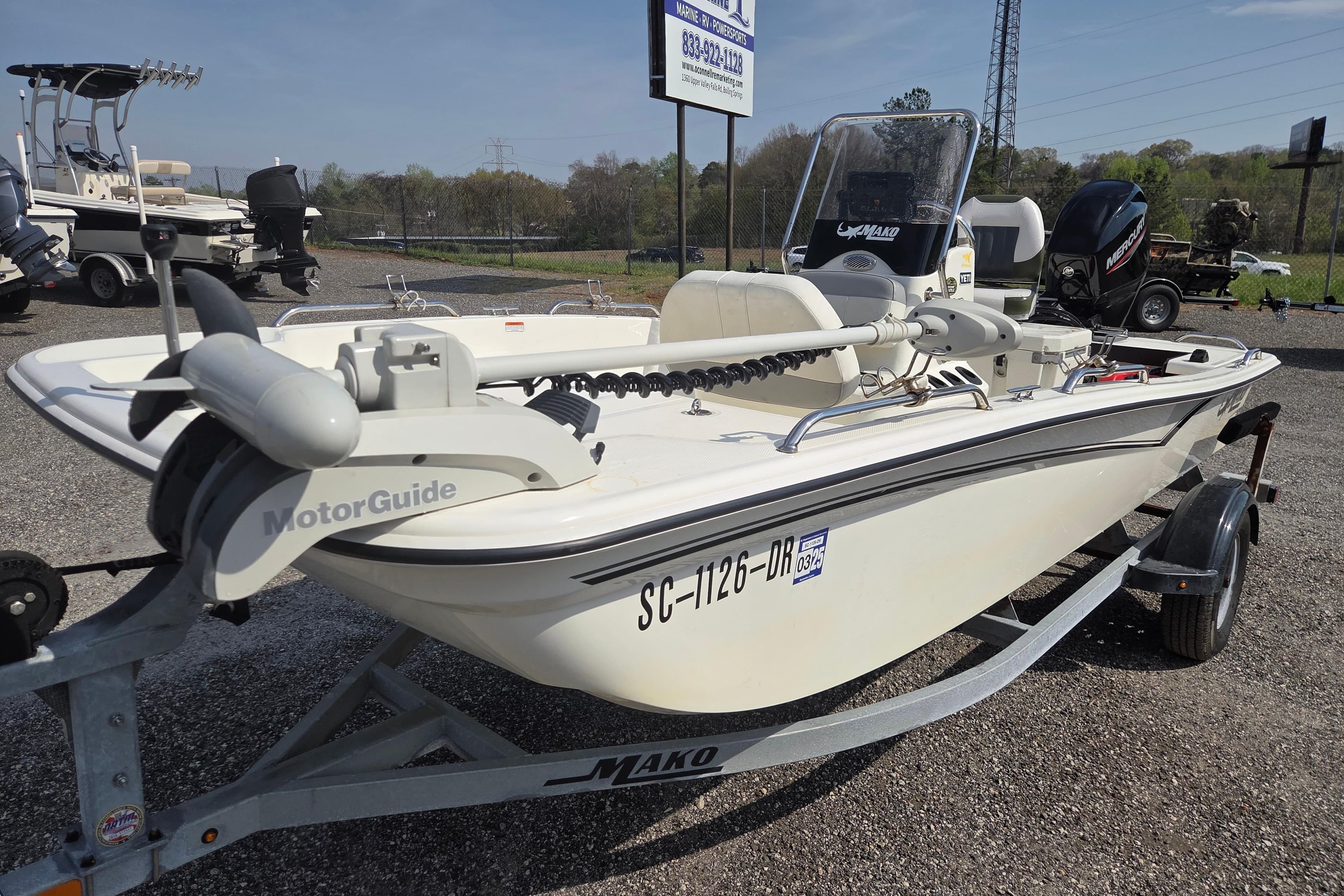 2021 Mako Pro Skiff 15 CC boat with MotorGuide trolling motor on trailer.