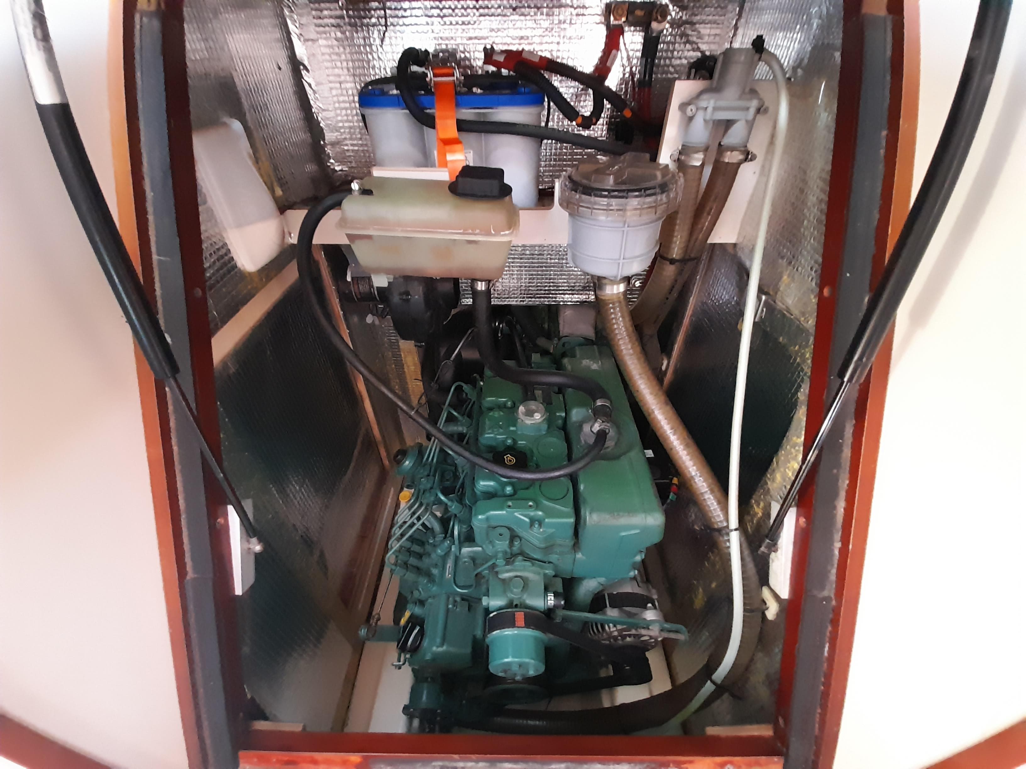 Engine compartment of a 2010 Hanse 445 sailboat, showcasing mechanical components.