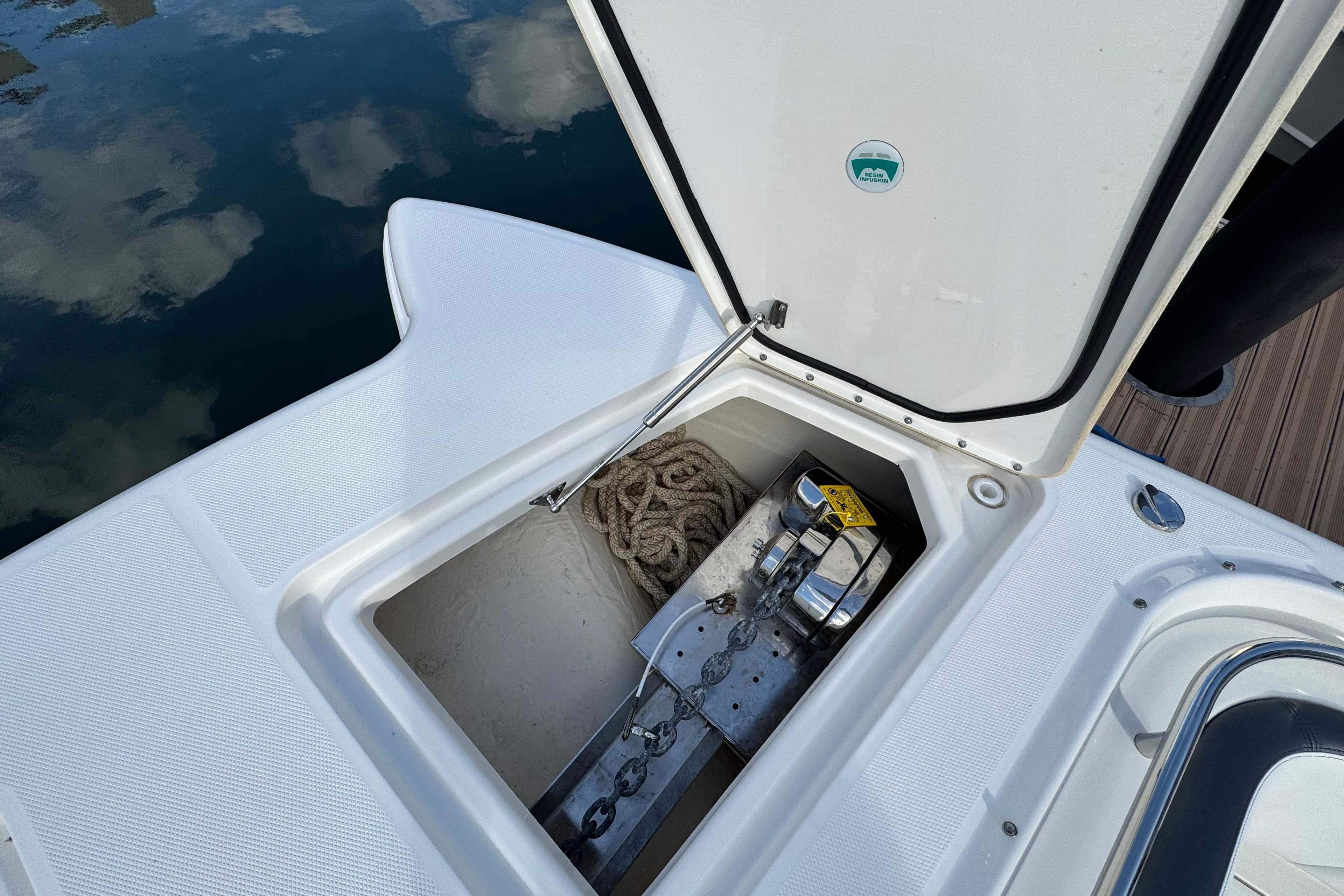 2023 World Cat 400 DC-X boat anchor compartment with rope and chain.
