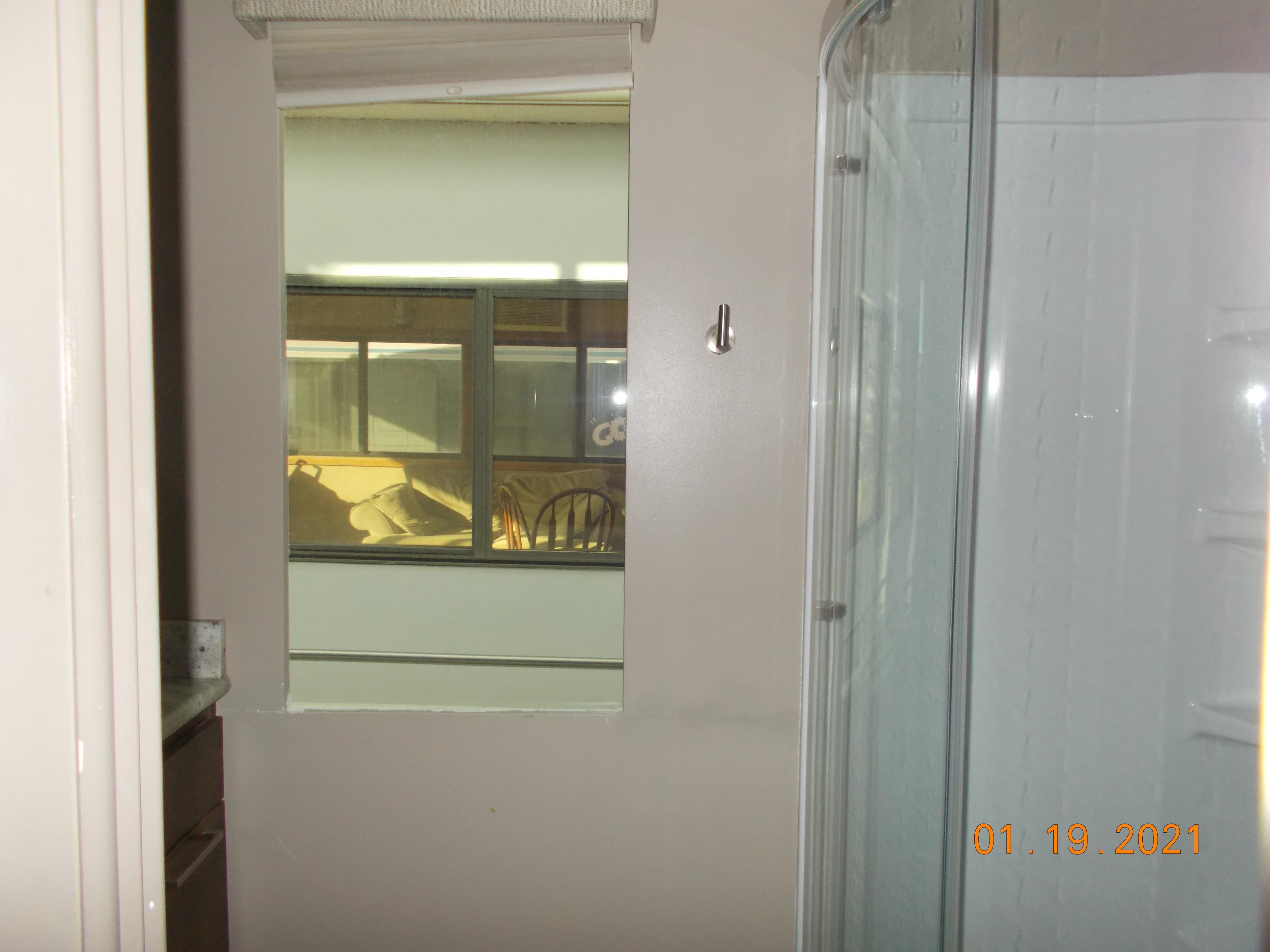 Bathroom with shower enclosure and window, taken on January 19, 2021.