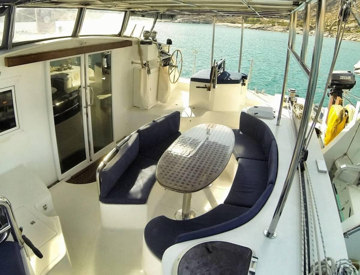 Spacious deck of 2007 Custom ISoCatamarans 60 with seating and table.