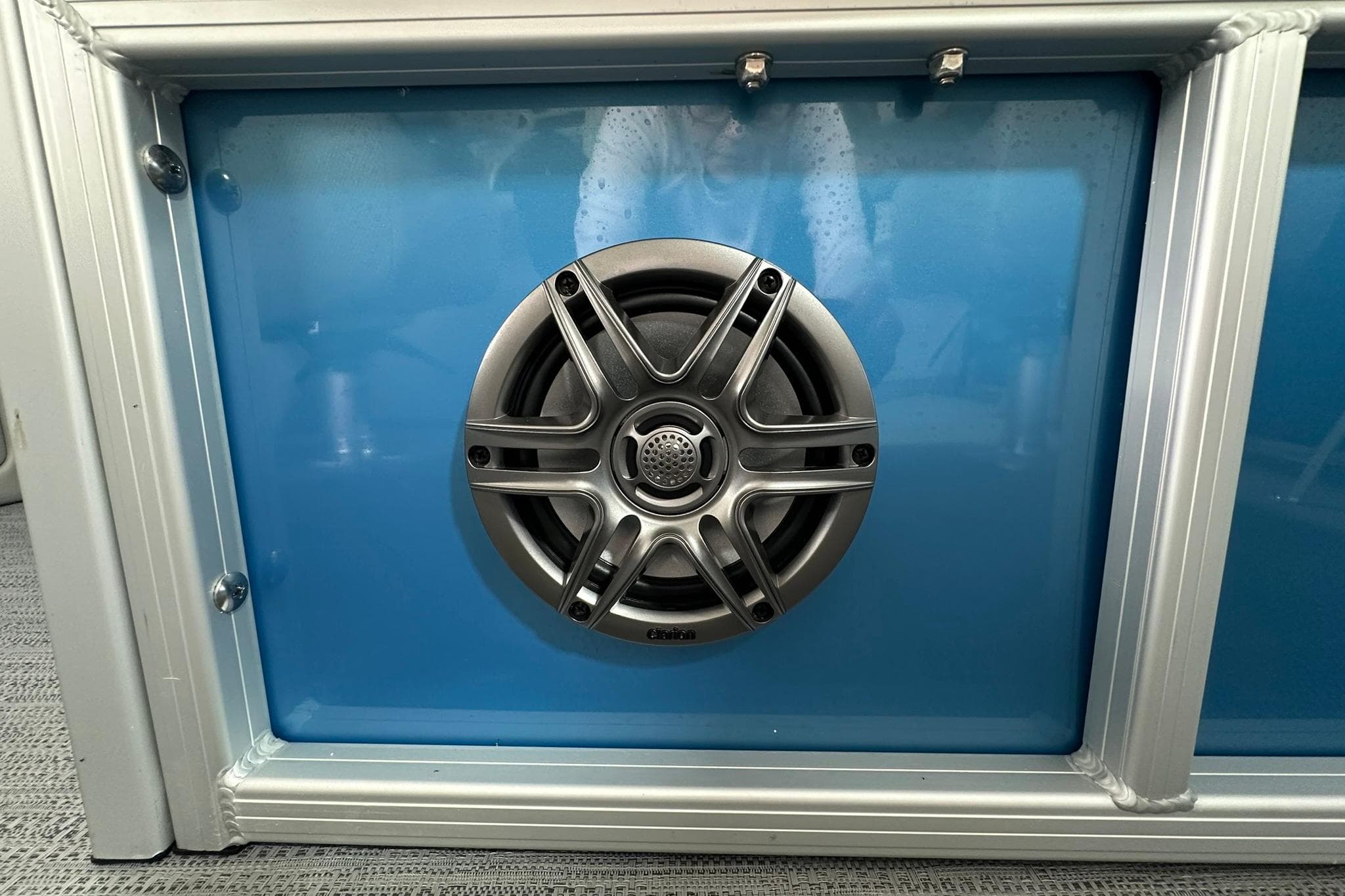 Speaker mounted on blue panel of 2026 Sweetwater EX2086SFLX.