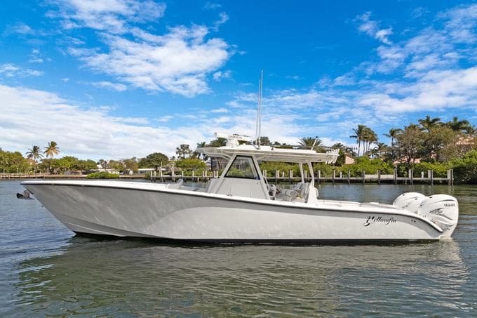2020 Yellowfin 39 Center Console boat on a calm waterway under a blue sky.