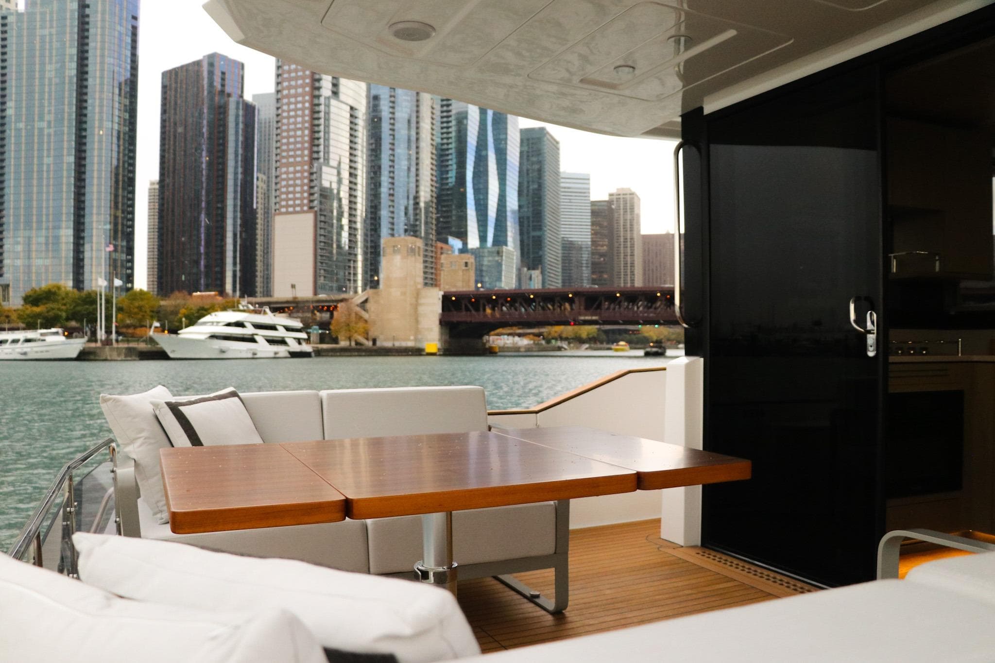 Luxurious Sirena 48 Flybridge yacht with city skyline view, 2026 model.