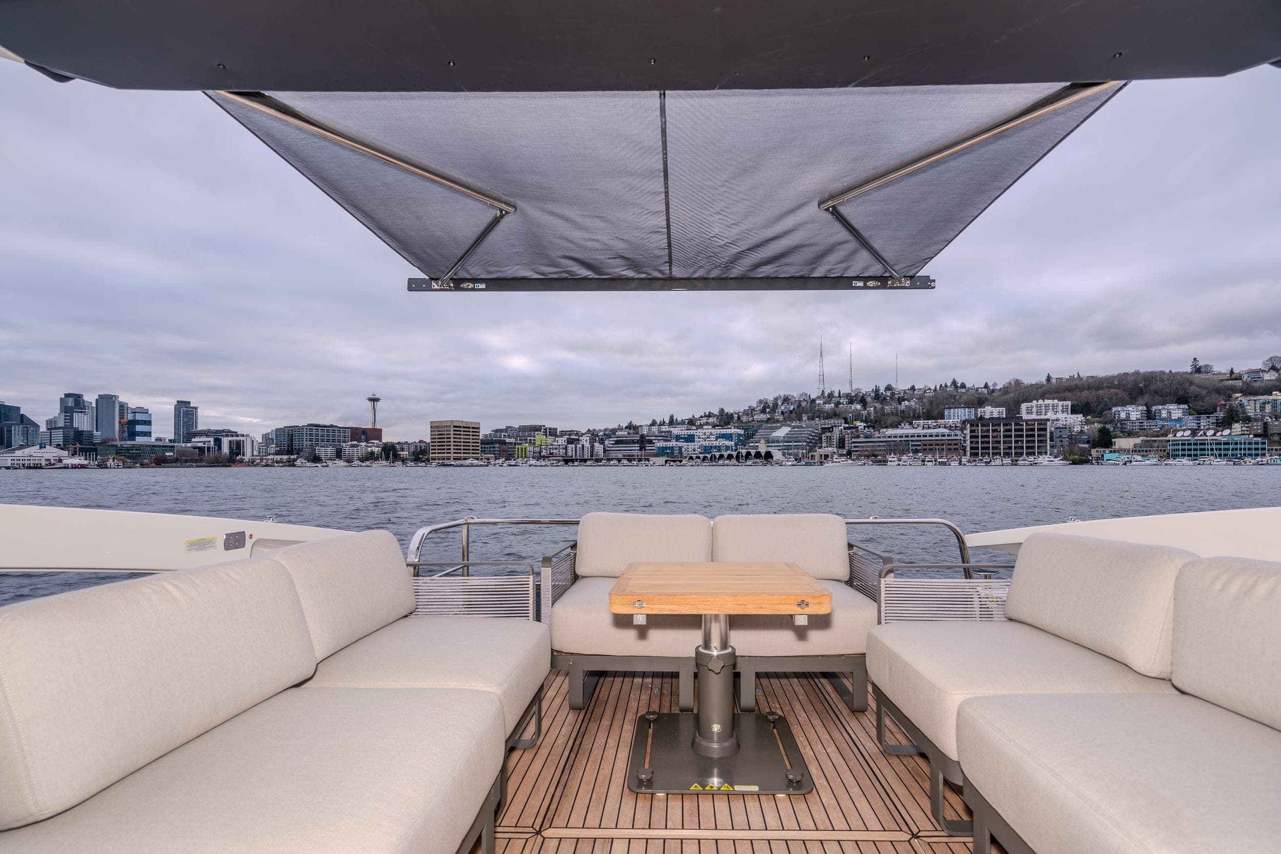 Luxurious Absolute 48 Coupe yacht interior with city skyline view, 2026 model.