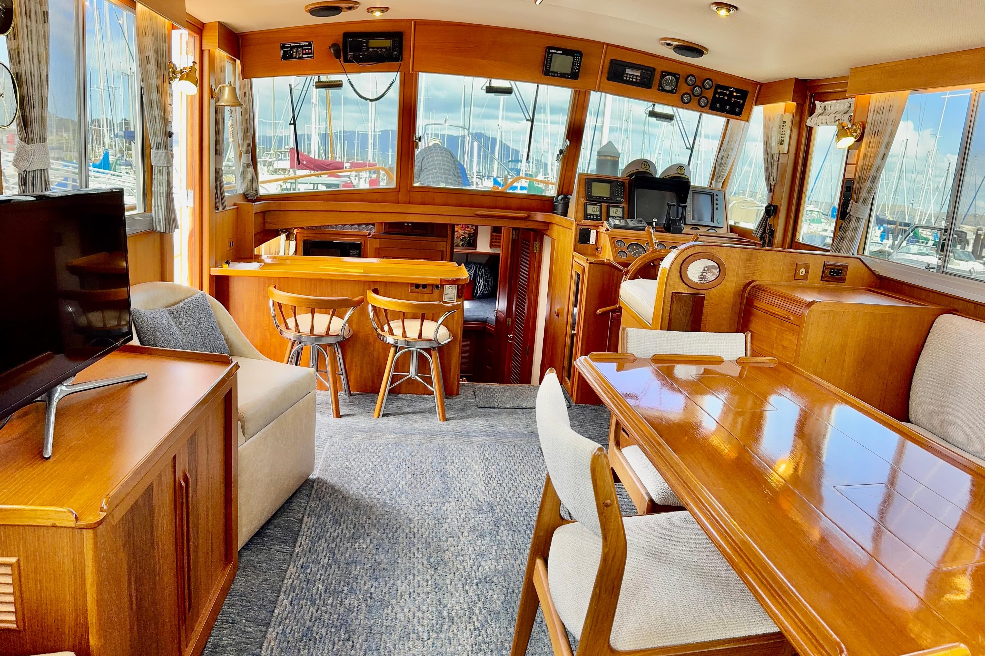 Luxurious 1996 Grand Banks 46 Heritage CL yacht interior with elegant wood furnishings and modern amenities.