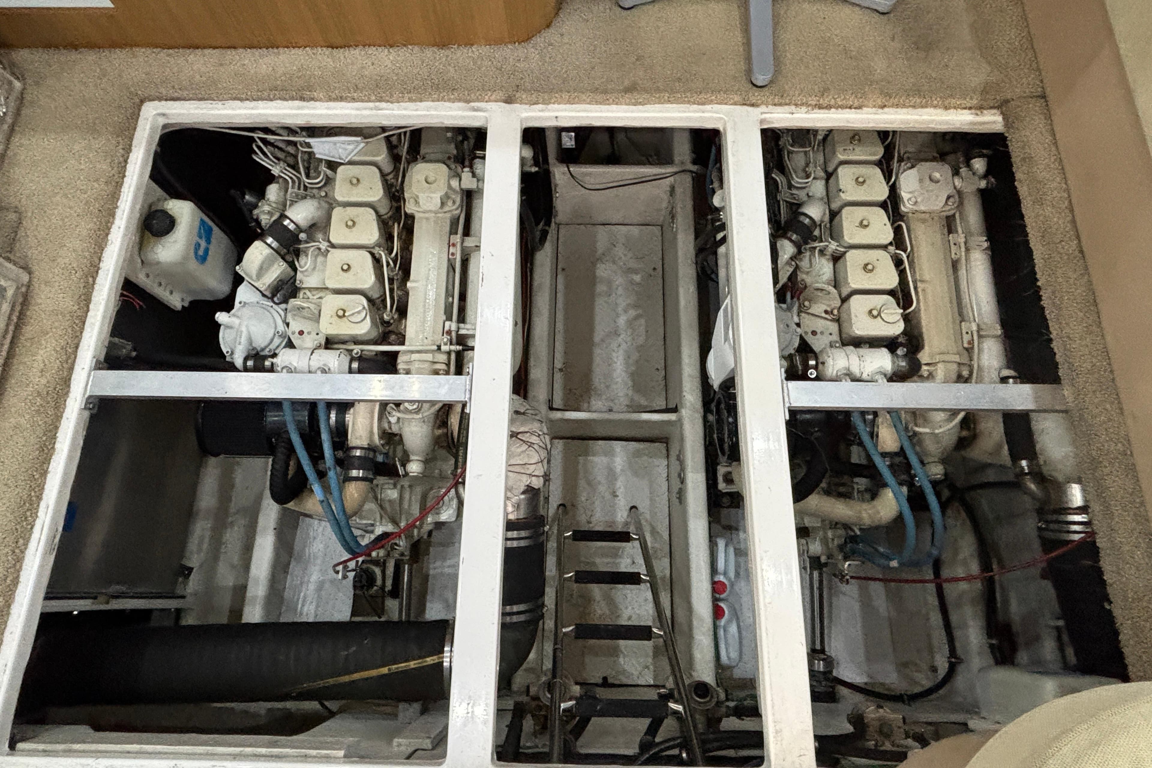 Engine room of 2000 Bayliner 3788 Command Bridge Motoryacht, showcasing dual engines.