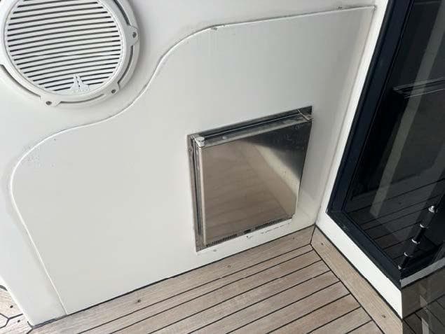 Stainless steel hatch and speaker on 2008 Marquis 40 SC yacht deck.