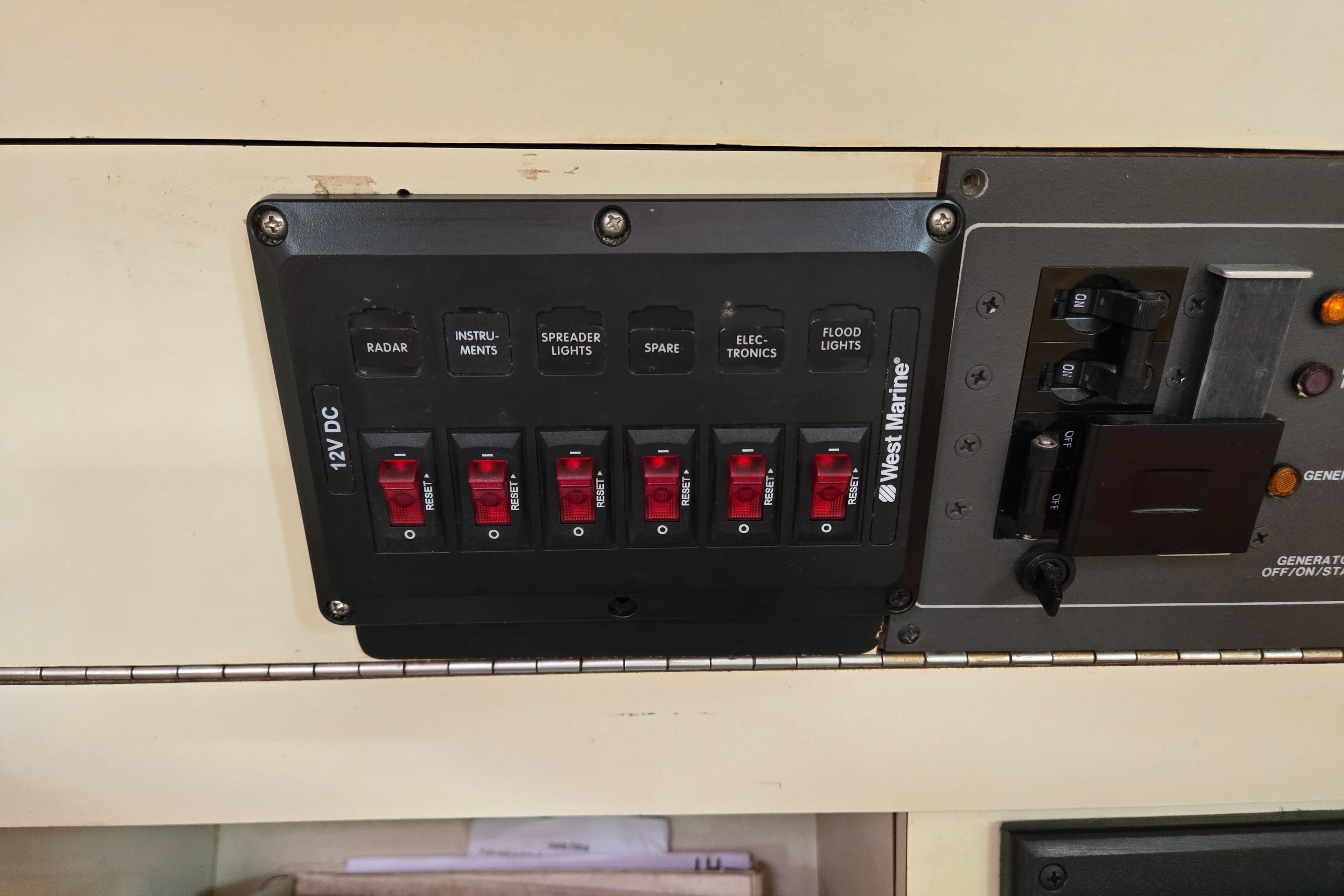 Control panel on a 1989 Pearson 37-2 sailboat with labeled switches and circuit breakers.