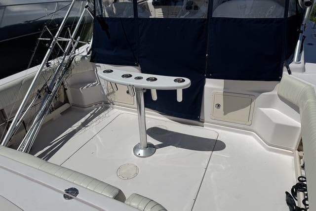 2008 Grady White 330 Express boat deck with fishing rod holders and seating.