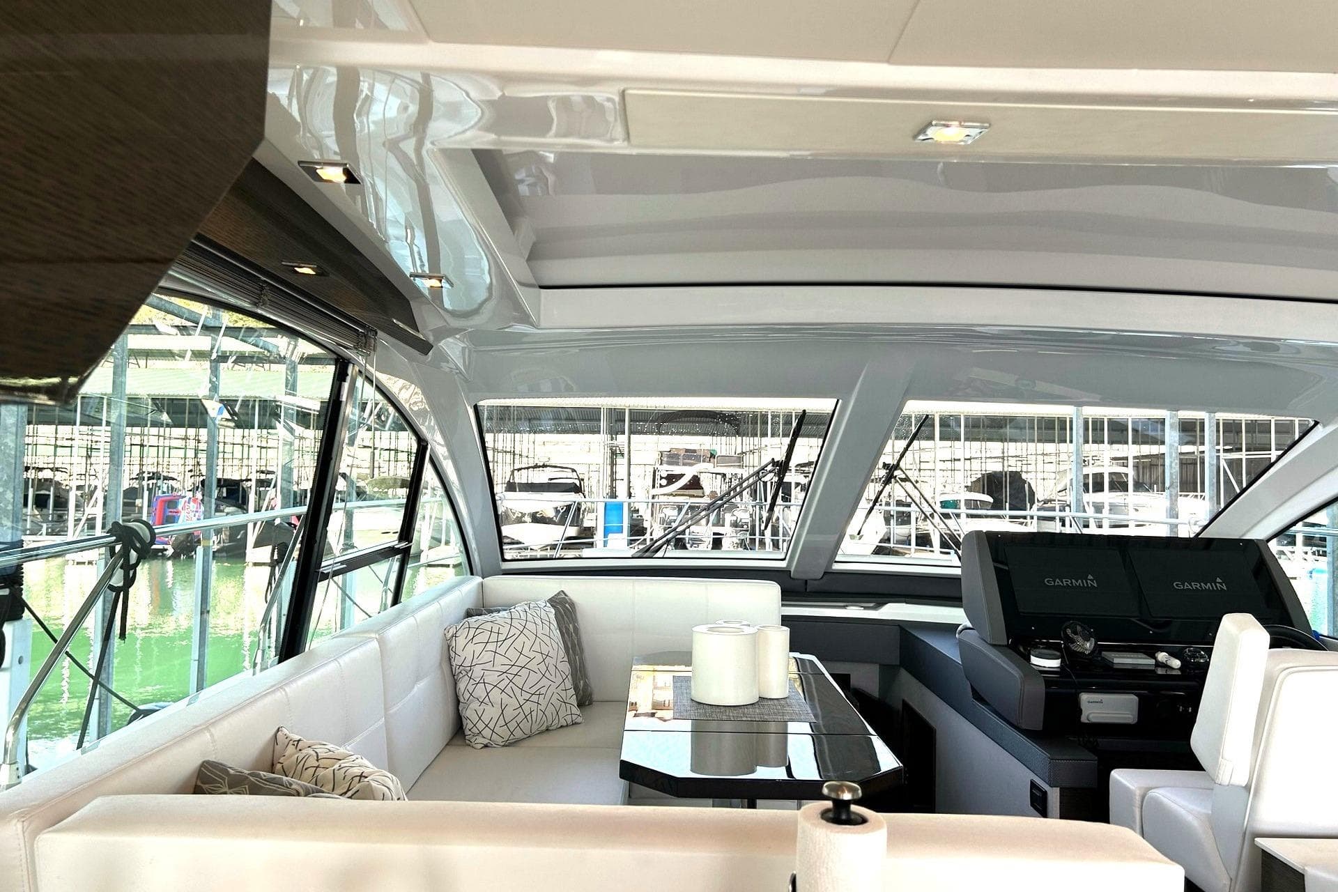 Luxurious interior of 2021 Cruisers Yachts 50 Cantius with modern seating and helm.