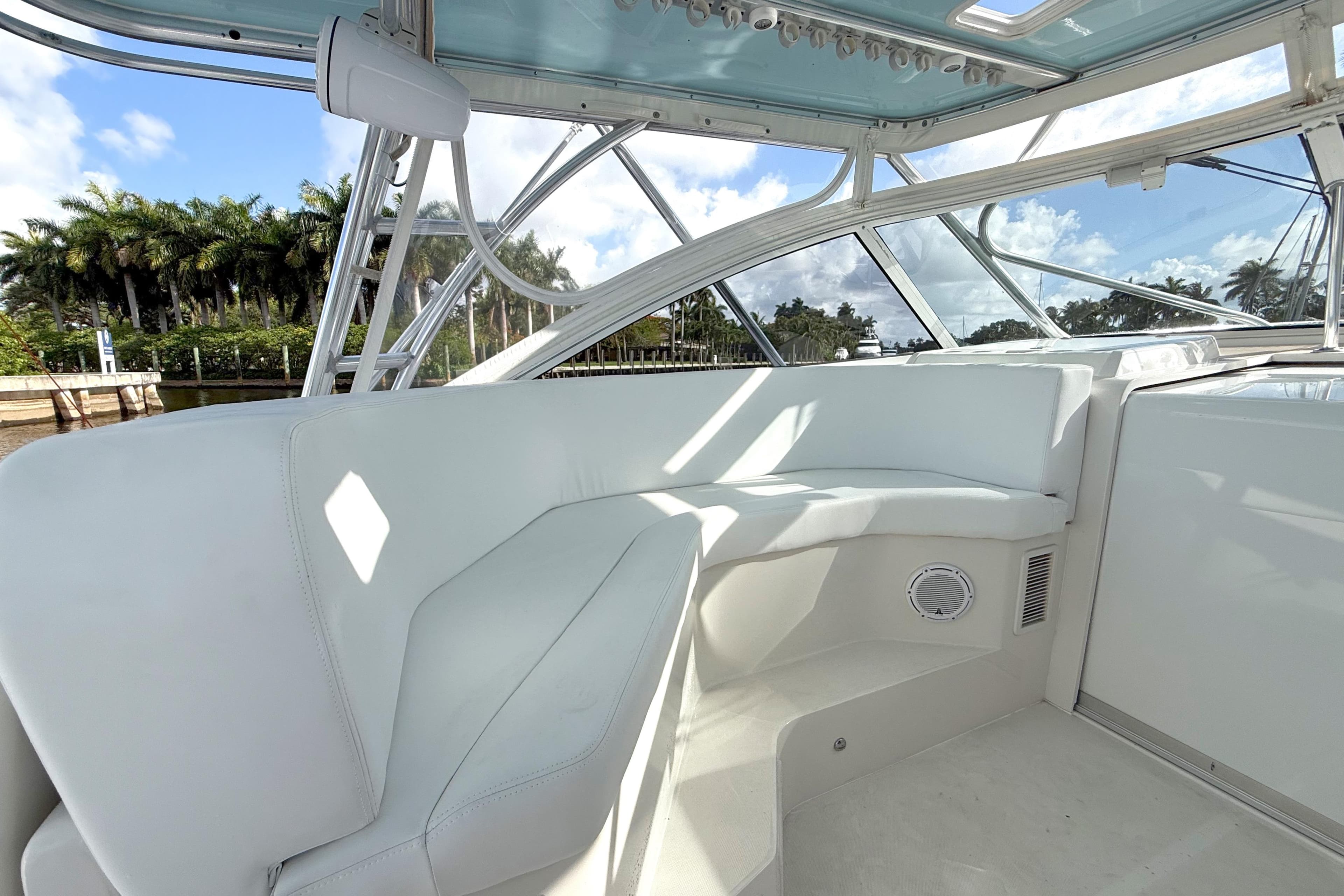 2009 Jupiter 39 Express boat interior with white seating and clear windows.