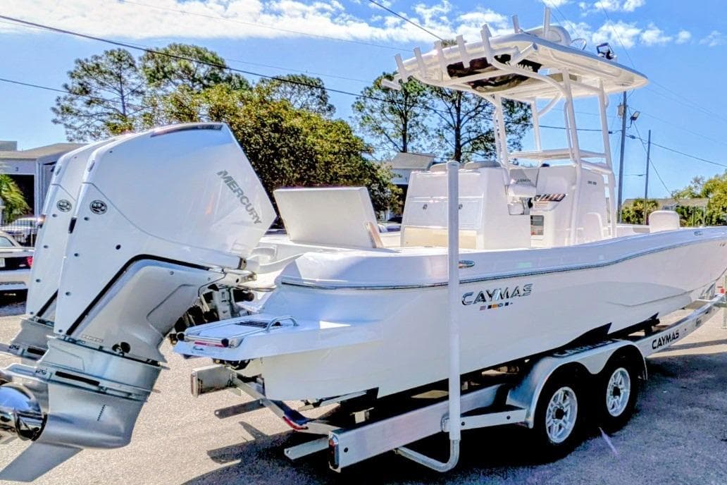 2026 Caymas 281 HB boat with dual Mercury engines on a trailer.
