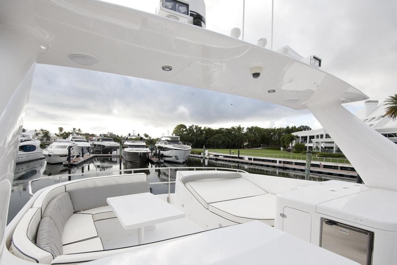 Luxurious 1995 Custom Heisley yacht with spacious deck and marina view.